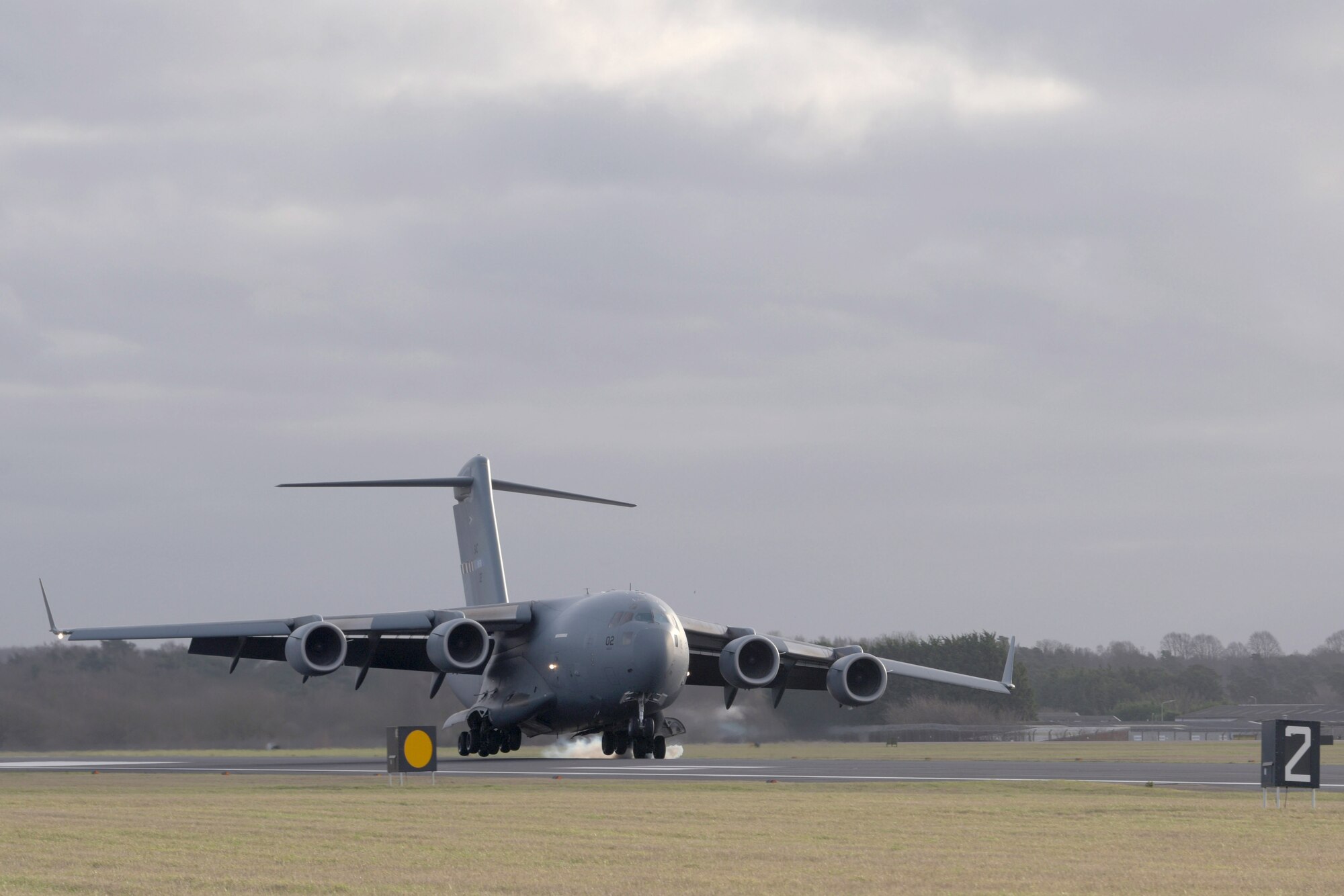 A C-17 Globemaster III assigned to the Heavy Airlift Wing, Pápa Air Base, Hungary, lands at RAF Mildenhall, England, Jan. 11, 2020. The HAW came to RAF Midenhall to deliver the Boom Operator Weapon System Trainer. (U.S. Air Force photo by Senior Airman Benjamin Cooper)