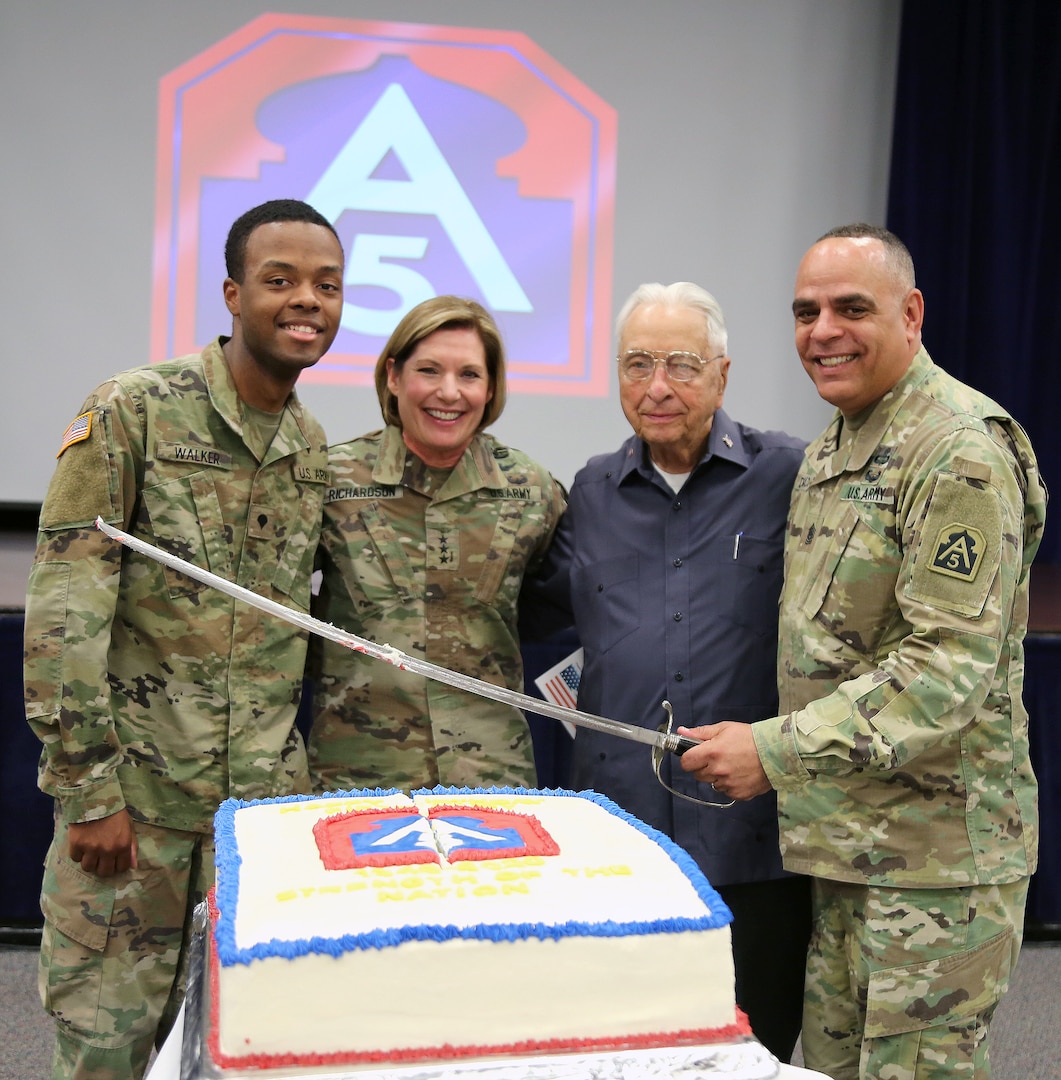 Spc. Dazhir Walker, 323d U.S. Army Band “Fort Sam’s Own;” Lt. Gen. Laura Richardson, commanding general, U.S. Army North (Fifth Army) and senior commander, Joint Base San Antonio-Fort Sam Houston and JBSA-Camp Bullis, retired Command Sgt. Maj. Willie Noles; and Army North Command Sgt. Maj. Alberto Delgado, senior enlisted leader, JBSA-Fort Sam Houston and JBSA-Camp Bullis, cut a cake to celebrate Fifth Army’s 77th birthday at the Military & Family Readiness Center at JBSA-Fort Sam Houston Jan. 10.
