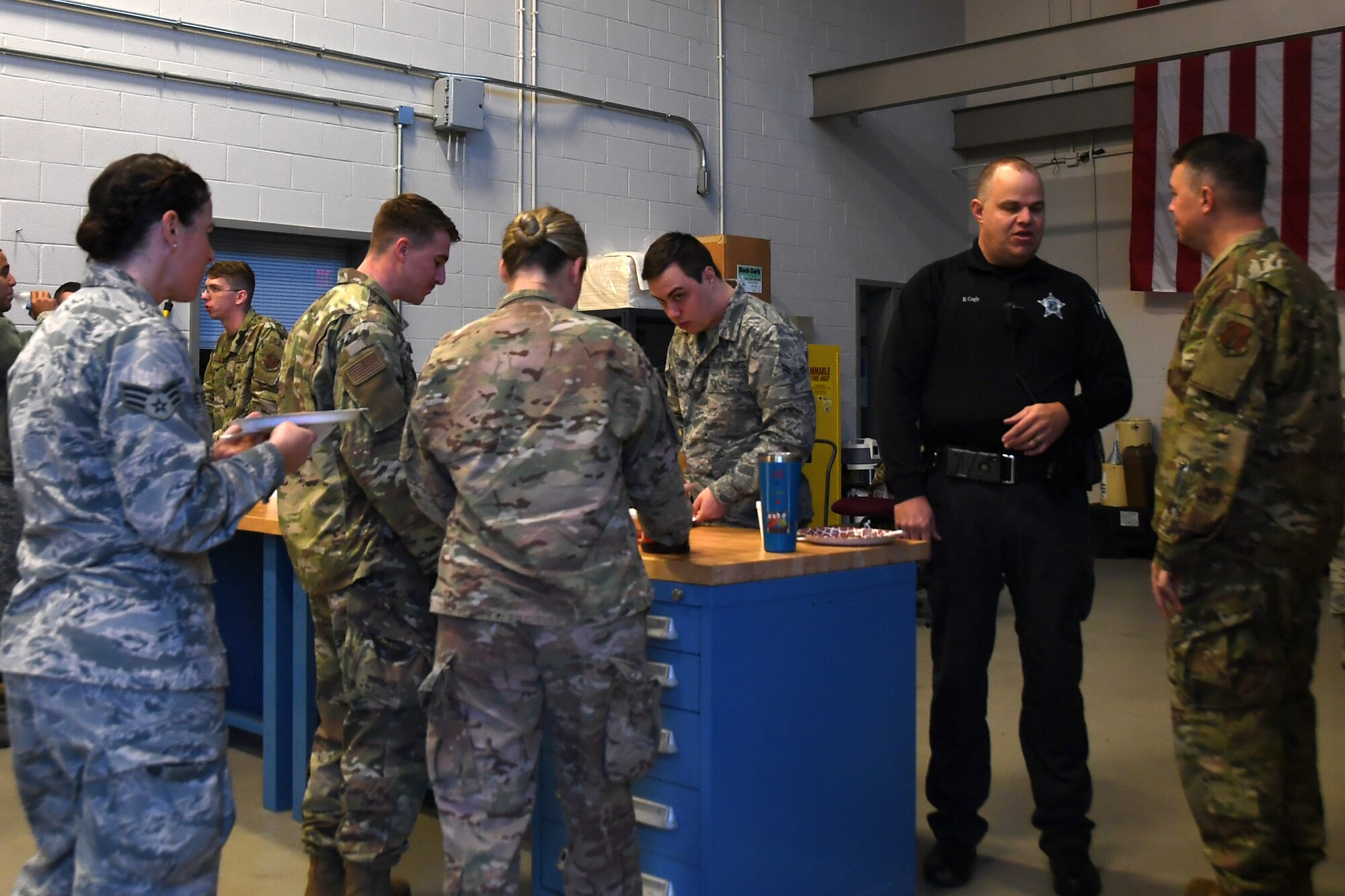 Local New London law enforcement and North Carolina Air National Guardsmen mingle during a pancake breakfast fundraiser, Jan. 12, 2020 at the 235th Air Traffic Control Squadron in New London, N.C. Members of the North Carolina Air National Guard as well as local airport authorities and law enforcement were invited to participate in a pancake breakfast social in order to strengthen community ties and build new relationships while raising funds for Morale, Welfare and Recreation.