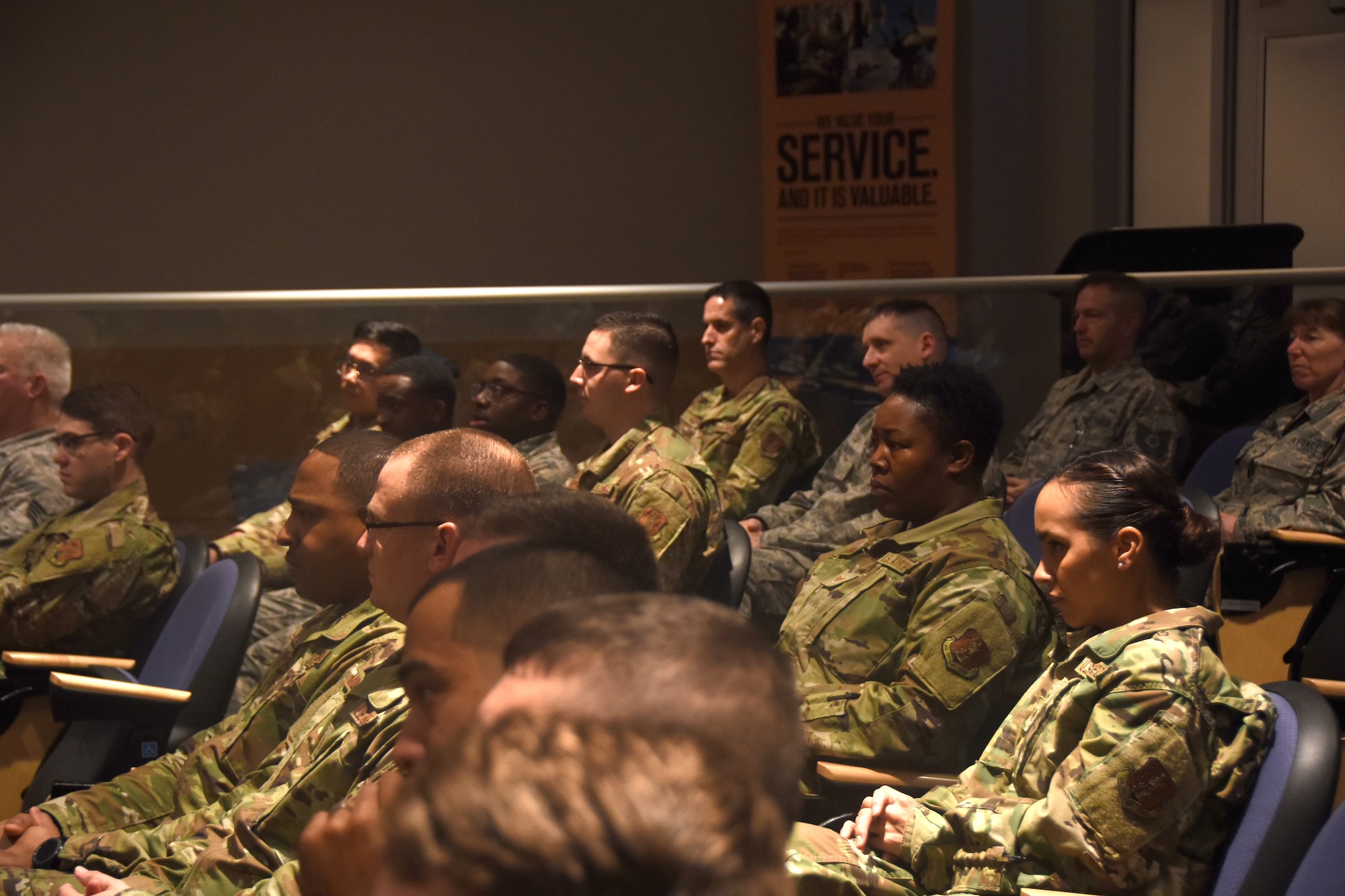 Members of the North Carolina Air National Guard listen as U.S. Air Force North Carolina Assistant Adjutant General for Air, Brig. Gen. Stephen Mallette delivers a speech before presenting Master Sgt. Daniel Judd and Master Sgt. Kernice Locklear, 263rd Combat Communications Squadron with awards during an all-call held at the New London, N.C. Air National Guard Base (NCANG) headquarters, Jan. 12, 2020. Members of the NCANG celebrated the accomplishments of Master Sgts. Judd and Locklear who attended the United States Marine Corps Staff Non-Commissioned Officer Academy last year in an effort to better understand the traditions and customs of a sister service. Since attending the academies, Judd and Locklear have implemented U.S. Marine Corps. practices such as sharing unit history and helping newer Airmen feel more involved with more responsibilities.