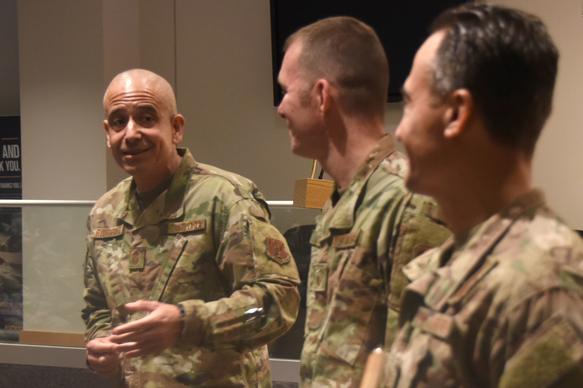 U.S. Air Force North Carolina State Command Chief Master Sgt. David Rodriguez (left) commends Master Sgt. Daniel Judd (center) and Master Sgt. Kernice Locklear (right), 263rd Combat Communications Squadron after being presented with awards during an all-call held at the New London, N.C. Air National Guard Base (NCANG) headquarters, Jan. 12, 2020. Members of the NCANG celebrated the accomplishments of Master Sgts. Judd and Locklear who attended the United States Marine Corps Staff Non-Commissioned Officer Academy last year in an effort to better understand the traditions and customs of a sister service. Since attending the academies, Judd and Locklear have implemented U.S. Marine Corps. practices such as sharing unit history and helping newer Airmen feel more involved with more responsibilities.