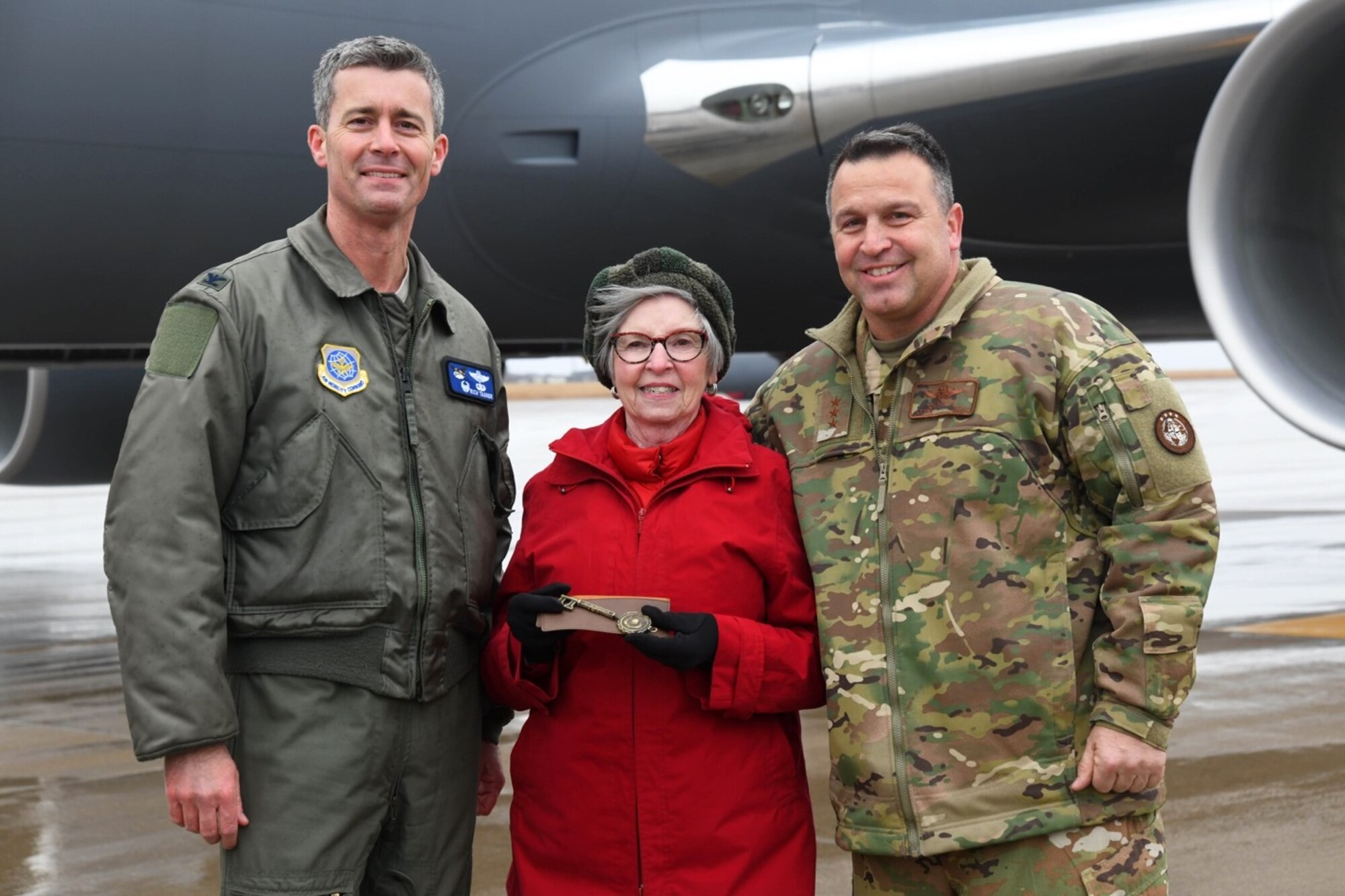 Col. Richard Tanner, 22nd Air Refueling Wing commander, and Pat Gallagher, Friends of McConnell director, present the key of the aircraft to Lt. Gen Thomas Sharpy, Headquarters Allied Command Transformation Capability Development deputy chief of staff, Jan. 10 2020, at McConnell Air Force Base, Kan. This is the 21st KC-46 Pegasus to be delivered to McConnell. (U.S. Air Force photo by Airman 1st Class Nilsa E. Garcia)