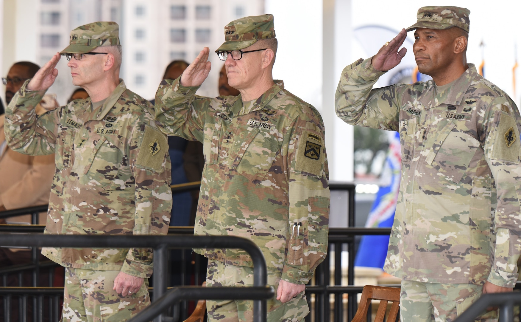(From left) Maj. Gen. Dennis P. LeMaster, Lt. Gen. James E. Rainey and Maj. Gen. Patrick D. Sargent salute the national colors during the playing of the national anthem during the U.S. Army Medical Center of Excellence change of command ceremony at Joint Base San Antonio-Fort Sam Houston Jan. 10.