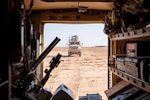 U.S. Soldiers of the 663rd Ordnance Company, 242nd Ordnance Battalion, drive military vehicles to the explosives range at Al Asad Air Base, Iraq, Nov. 29, 2019. The Explosive Ordnance Disposal Soldiers utilize these ranges to provide controlled disposal of explosive Ordnance. The Coalition is in Iraq by invitation of, and operates in close coordination with, the Government of Iraq. (U.S. Army photo by Spc. Derek Mustard)