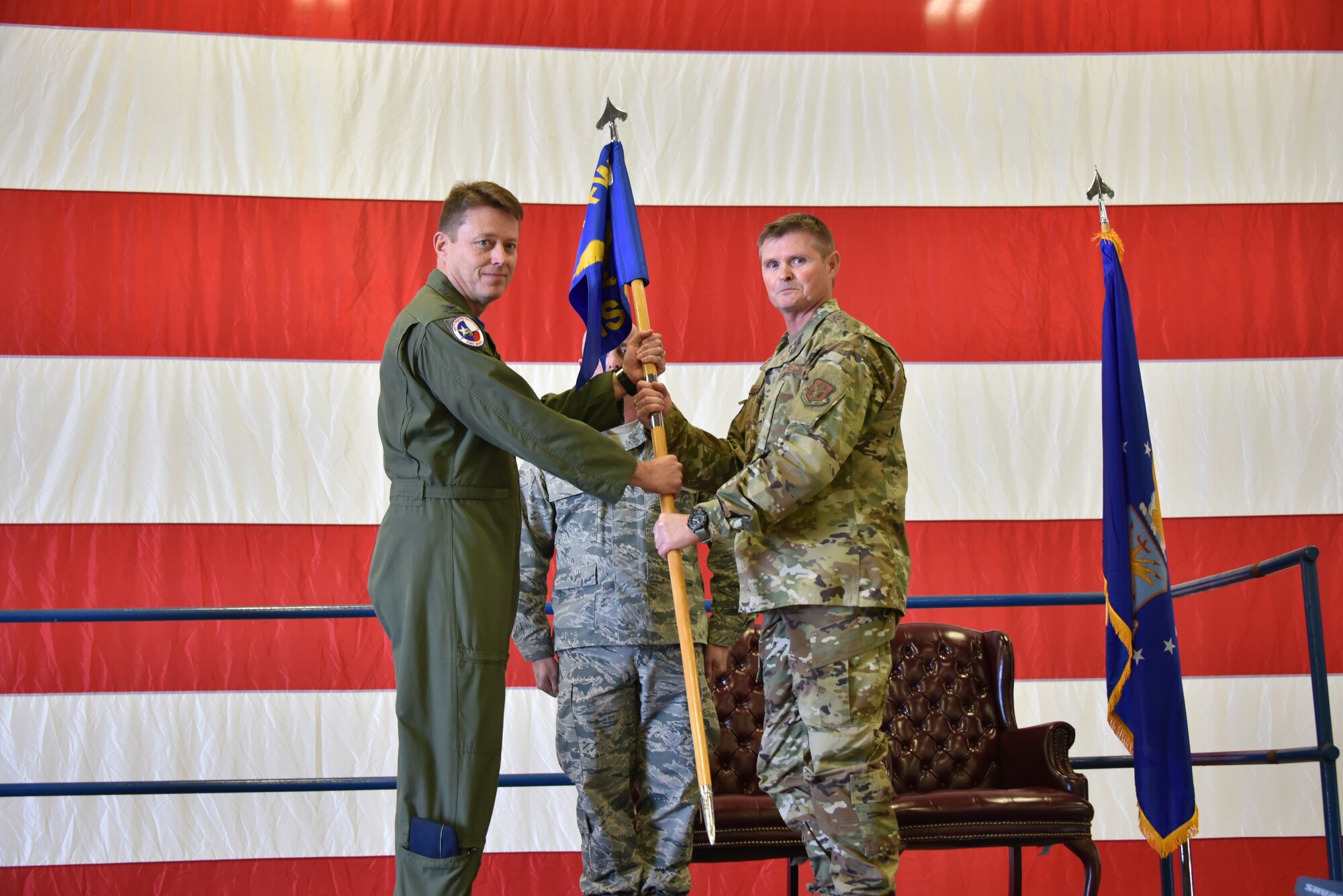 Col. L. Gregg Russell takes command of the 301st Mission Support Group as he receives the guidon from Col. Mitchell Hanson, 301 FW commander, Jan. 12, 2020, at Naval Air Station Joint Reserve Base Fort Worth, Texas. When the incoming commander takes the guidon during an assumption of command ceremony, it symbolizes the authority given to them to lead their group and the responsibility to take care of their Airmen and their mission. (U.S. Air Force photo by Senior Airman Brittany Landy)