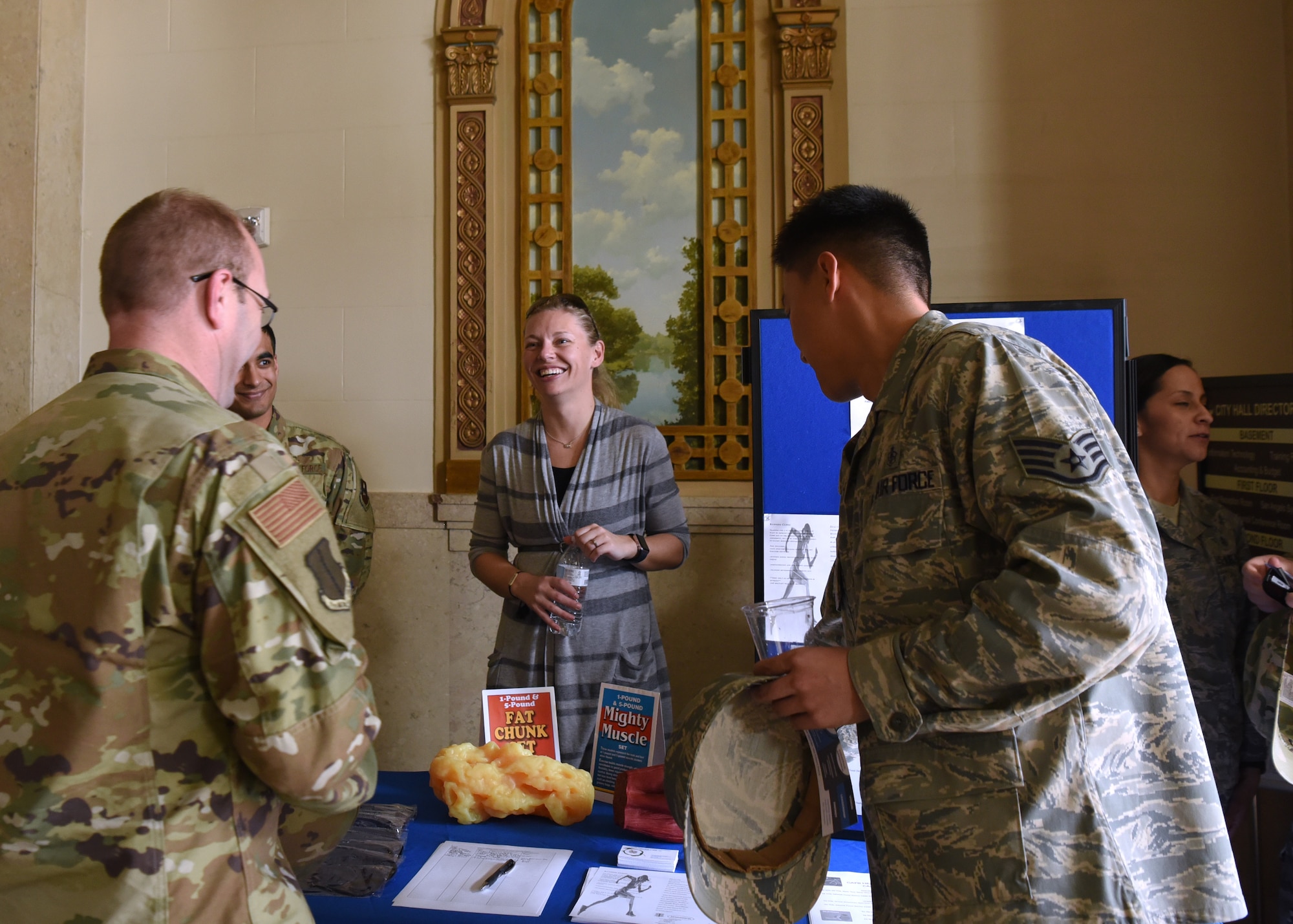 U.S. Air Force 17th Medical Group Health Promotion Coordinator Elizabeth Burmeister, engages with Goodfellow Air Force Base members at an information booth before a Commander’s Call at the Murphey Performance Hall in San Angelo, Texas, Jan. 9, 2020. Burmeister encouraged individuals to sign pledges, giving up smoking or other unhealthy habits. (U.S. Air Force photo by Airman 1st Class Abbey Rieves)