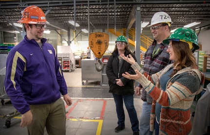 Marlene Bell, Puget Sound Naval Shipyard & Intermediate Maintenance Facility's American Sign Language interpretor, communicates with Shop 51 Marine Electrician Brandon Salley (left) during Category 3 User Shop Crane Operator Training Dec. 3 while Code 724 Supervisory Training Specialist Jay Lucas provides instruction and Deb Chard from Code 900S, Waterfront Safety, observes.