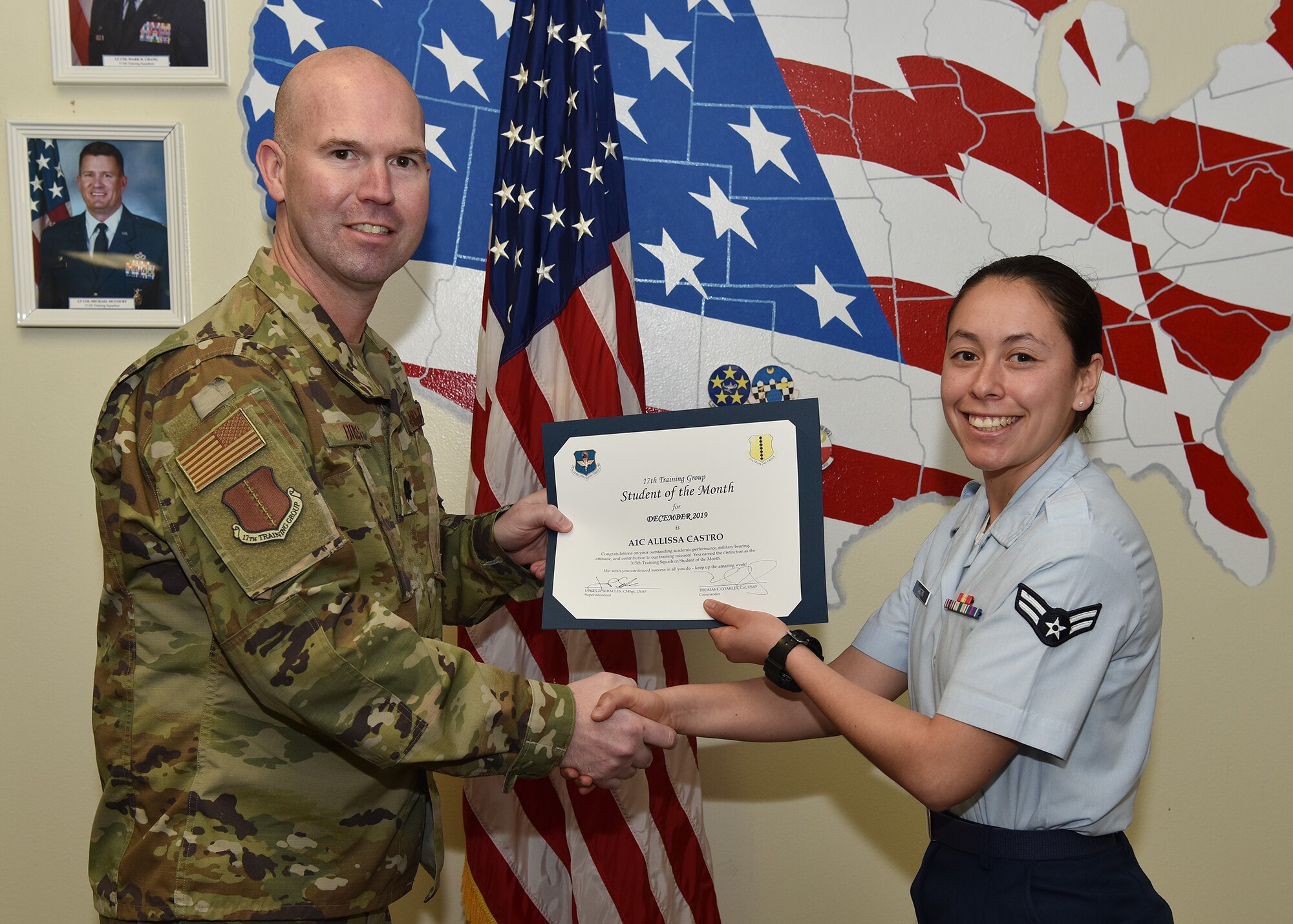 U.S. Air Force Lt. Col. Kevin Boss, 17th Training Group deputy commander, presents the 315th Training Squadron Student of the Month award to Airman 1st Class Allissa Castro, 315th TRS student, at Brandenburg Hall on Goodfellow Air Force Base, Texas, Jan. 10, 2020. The 315th TRS’s mission is to train, educate, and mentor future intelligence, surveillance, and reconnaissance warriors through innovation. (U.S. Air Force photo by Staff Sgt. Chad Warren)