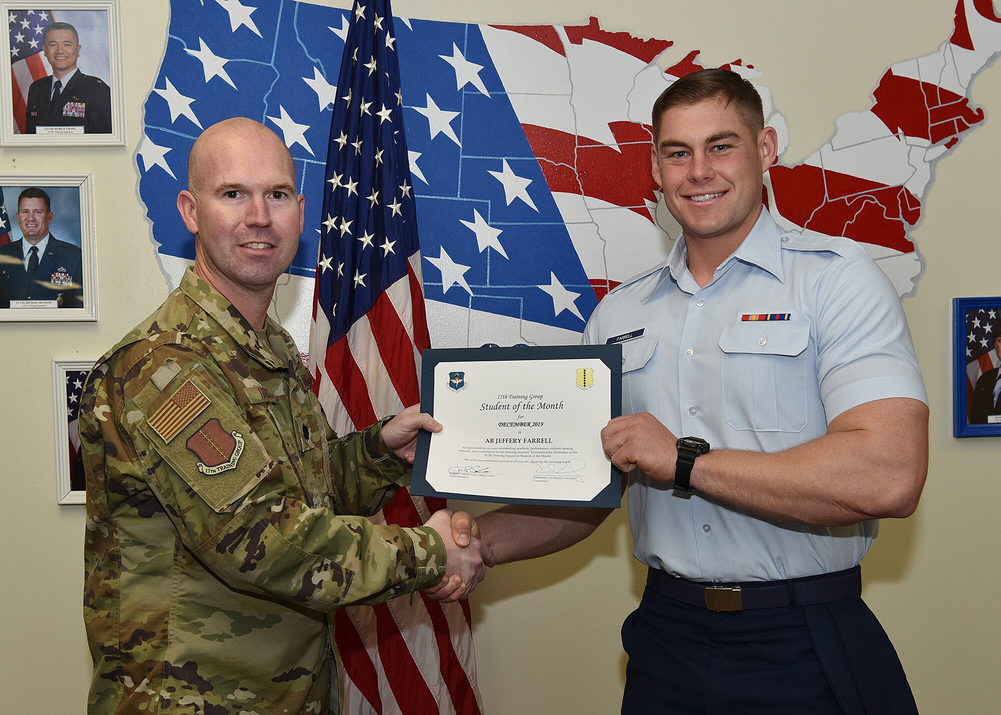 U.S. Air Force Lt. Col. Kevin Boss, 17th Training Group deputy commander, presents the 312th Training Squadron Student of the Month award to Airman Basic Jeffrey Farrell, 312th TRS student, at Brandenburg Hall on Goodfellow Air Force Base, Texas, Jan. 10, 2020. The 312th TRS’s mission is to provide Department of Defense and international customers with mission-ready fire protection and special instruments graduates and provide mission support for the Air Force Technical Applications Center. (U.S. Air Force photo by Staff Sgt. Chad Warren)