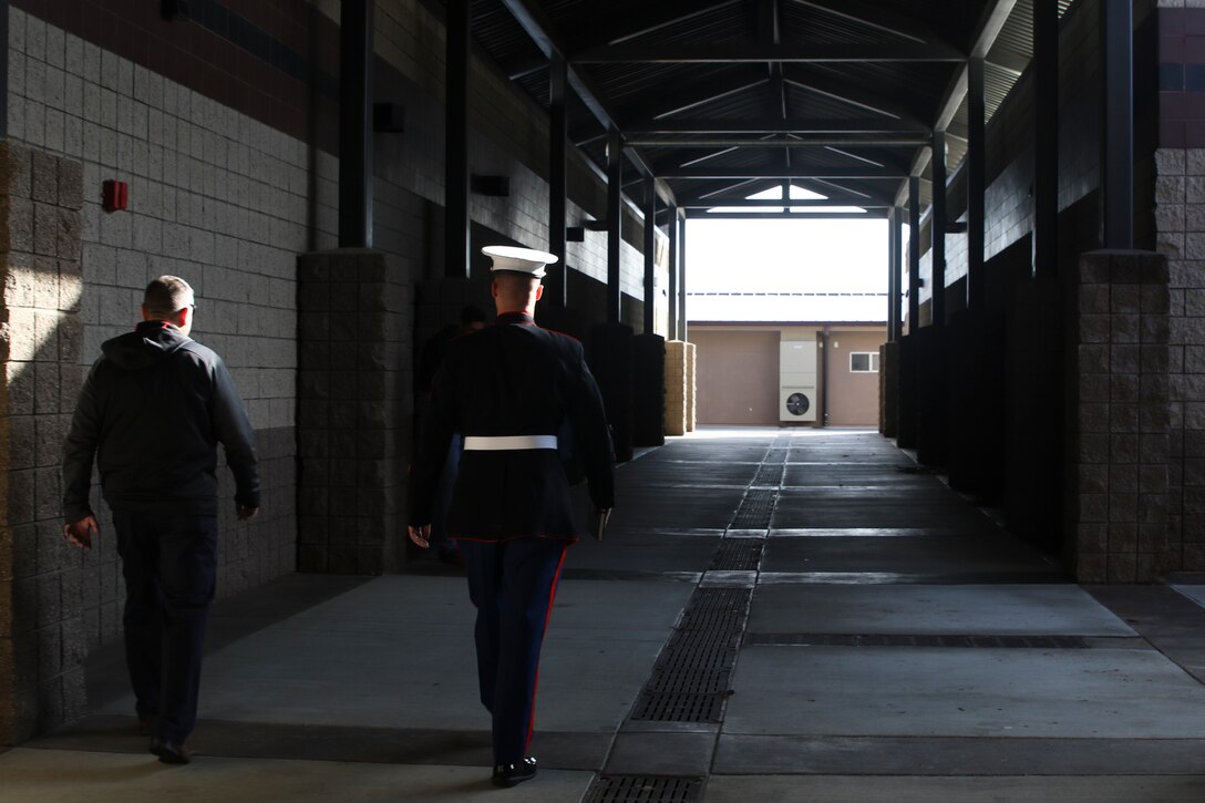 Michael Capps, Oak Hills High School Principal, walks alongside Sgt. Mark Reinsberg, a Marine recruiter with Recruiting Station Riverside during the Principal for a Day event held at Oak Hills High School in Oak Hills, CA, Nov. 21, 2019. Principal for a Day is a program run by Hesperia Unified School District designed to show local leaders and community members the state of the schools in the area and discuss what can be improved. (U.S. Marine Corps photo by Sgt. Juan Madrigal)