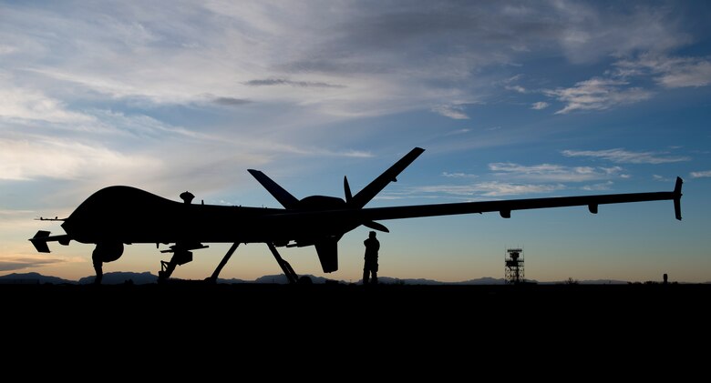Airmen from the 29th Aircraft Maintenance Unit check over the first MQ-9 Reaper to be transported through ferry flight here, Jan. 8, 2020, on Holloman Air Force Base, N.M. Transporting remotely piloted aircraft from California meant using the National Airspace System and required extra documentation to permit the flight. (U.S. Air Force photo by Airman 1st Class Autumn Vogt)