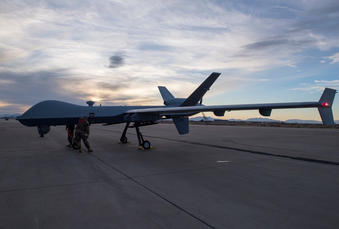 Airmen from the 29th Aircraft Maintenance Unit look over the 49th Wing’s newest MQ-9 Reaper, Jan. 8, 2020, on Holloman Air Force Base, N.M. This is the first remotely piloted aircraft to be ferried through the National Airspace to Holloman. (U.S. Air Force photo by Airman 1st Class Autumn Vogt)