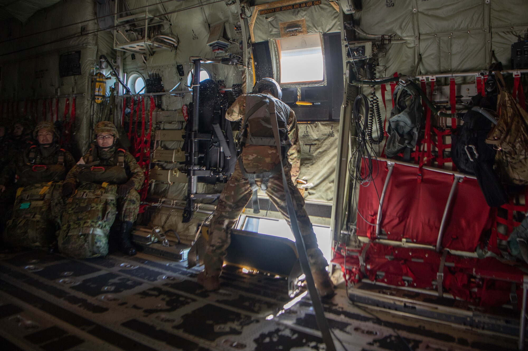 Loadmaster closes side door to C-130J Super Hercules.