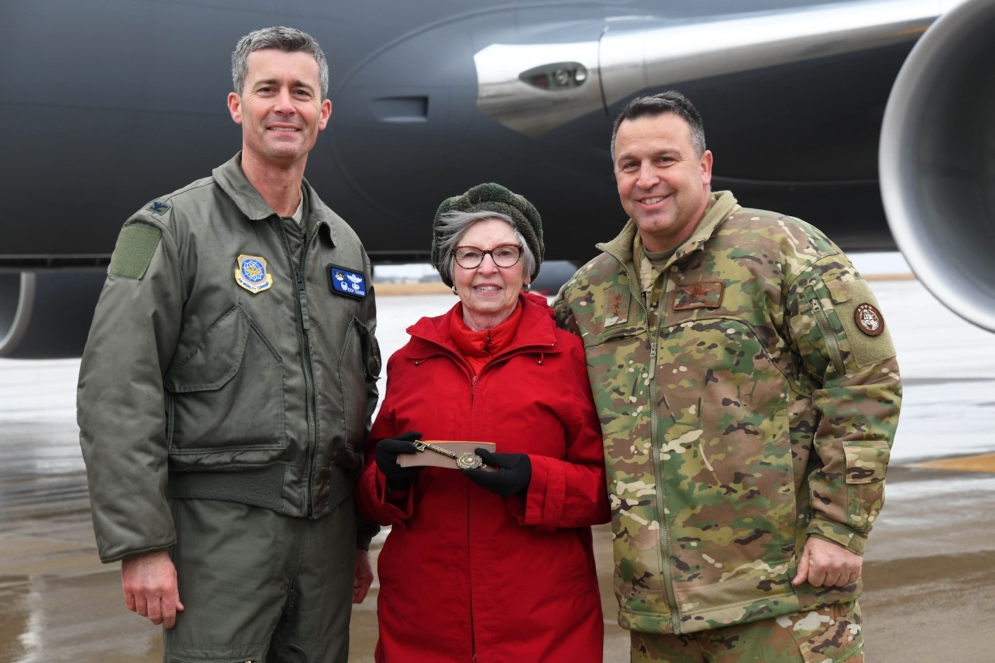 Col. Richard Tanner, 22nd Air Refueling Wing commander, and Pat Gallagher, Friends of McConnell director, present the key of the aircraft to Lt. Gen Thomas Sharpy, Headquarters Allied Command Transformation Capability Development deputy chief of staff, Jan. 10 2020, at McConnell Air Force Base, Kan. This is the 21st KC-46 Pegasus to be delivered to McConnell. (U.S. Air Force photo by Airman 1st Class Nilsa E. Garcia)