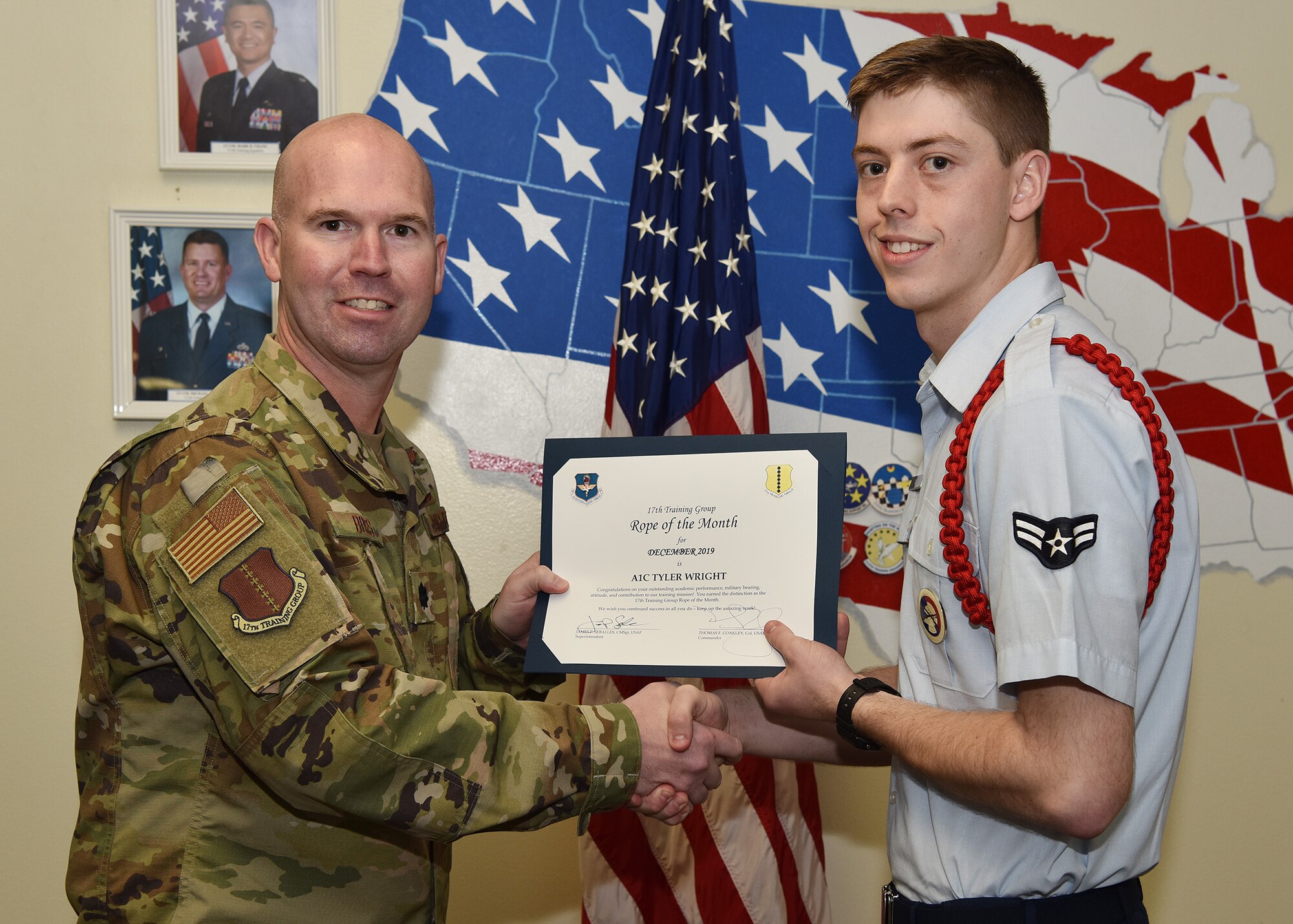 U.S. Air Force Lt. Col. Kevin Boss, 17th Training Group deputy commander, presents the 17th Training Group Rope of the Month award to Airman 1st Class Tyler Wright, 315th Training Squadron student, at Brandenburg Hall on Goodfellow Air Force Base, Texas, Jan. 10, 2019. The 315th TRS’s vision is to develop combat-ready intelligence, surveillance and reconnaissance professionals and promote an innovative squadron culture and identity unmatched across the U.S. Air Force. (U.S. Air Force photo by Staff Sgt. Chad Warren)