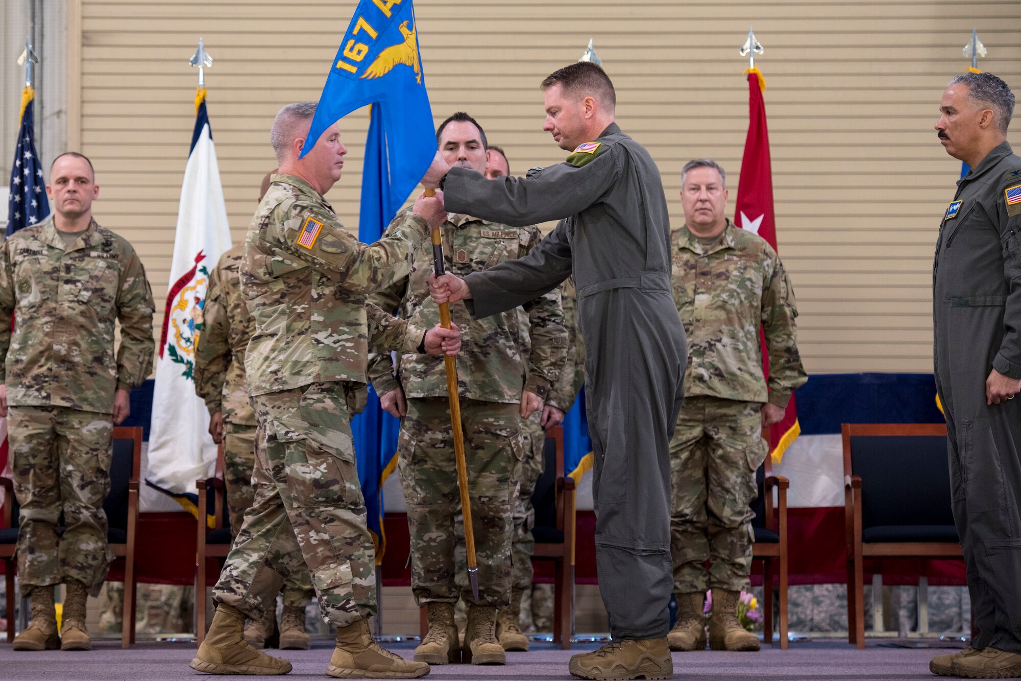 West Virginia National Guard Adjutant General, Maj. Gen. James Hoyer and Col. Martin Timko ceremoniously exchange the 167th Airlift Wing guidon during a change of command ceremony, Jan. 12, 2020. Timko assumed command of the wing, Col. David Cochran relinquished command during the ceremony.