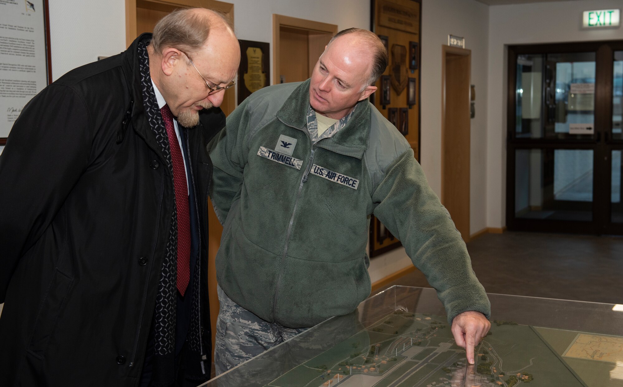 Dr. Heinrich Kreft, German ambassador to Luxembourg, left, and U.S. Air Force Col. Timothy Trimmel, 52nd Maintenance Group commander, center, view a model of Spangdahlem Air Base at Spangdahlem AB, Germany, January 13, 2020. Kreft toured the base and visited an aircraft hangar and a control tower to learn about how Airmen at Spangdahlem contribute to the mission. (U.S. Air Force photo by Airman 1st Class Alison Stewart)