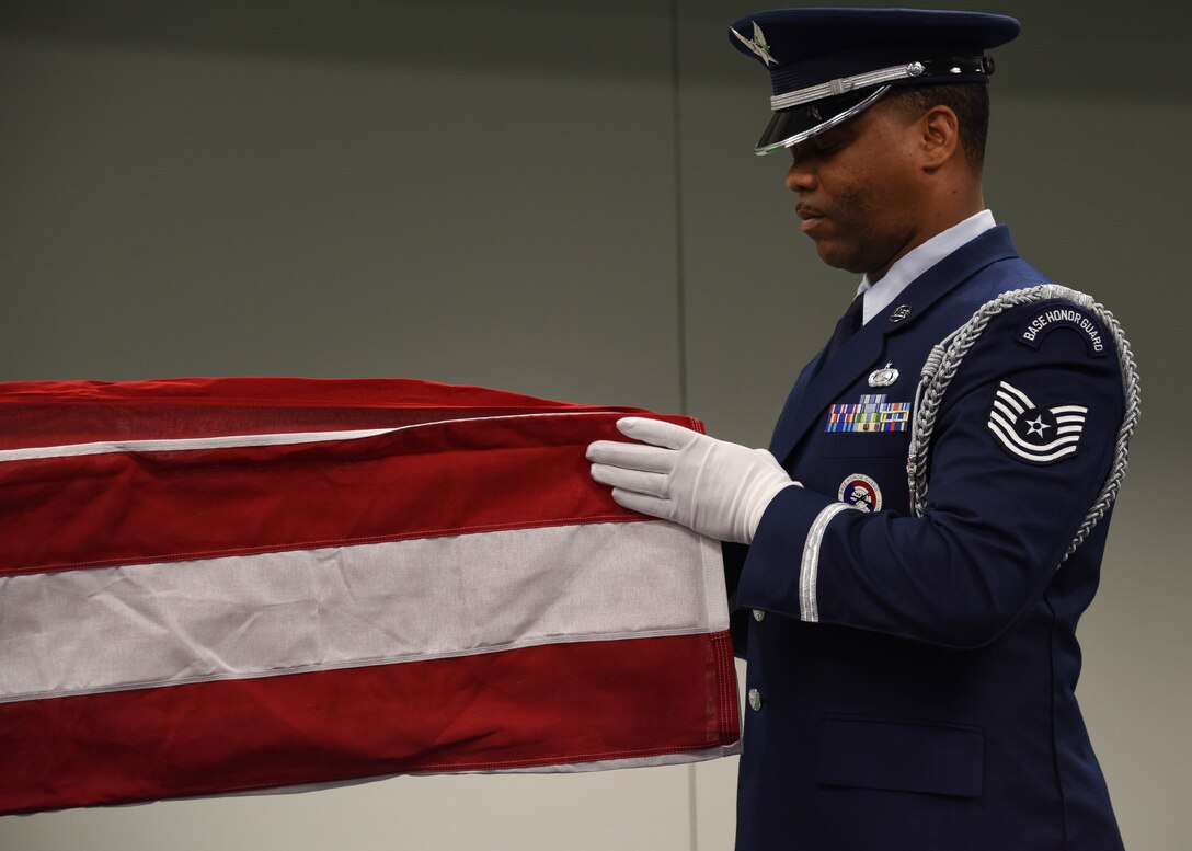 Tech. Sgt. Diontae Walker, a ceremonial guardsman assigned to the 911th Mission Support Group, folds the American flag during a base honor guard military funeral demonstration at the Pittsburgh International Airport Air Reserve Station, Pennsylvania, Dec. 8, 2019.