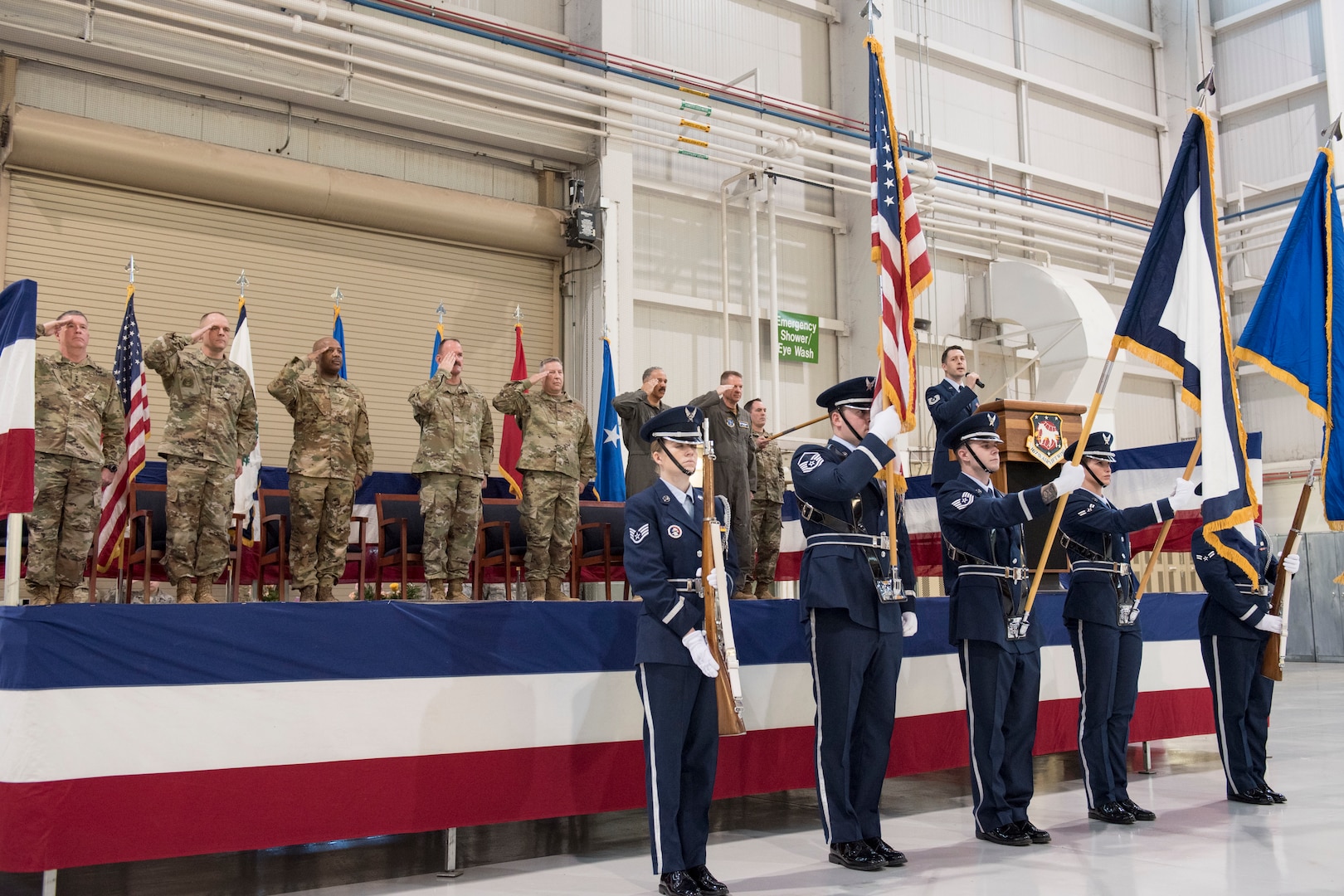 Tech. Sgt. Joshua Robins sings the national anthem as the 167th Airlift Wing’s Base Honor Guard presents the colors and the official party salutes the flag at the start of a change of command ceremony, Jan. 12, 2020. Col. Martin Timko assumed command of the wing and Col. David Cochran relinquished command during the ceremony.