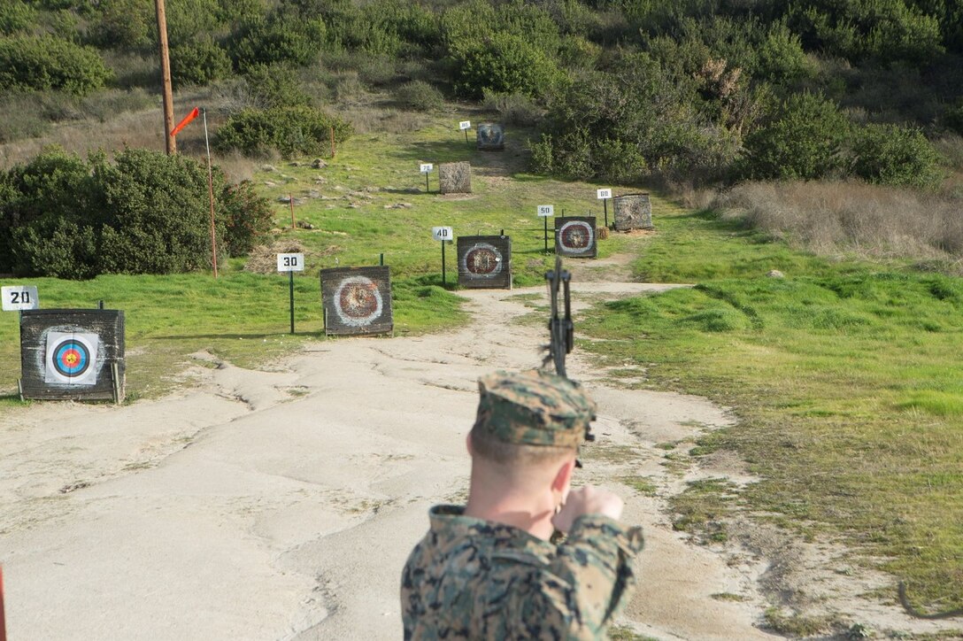 U.S. Marine Corps Lance Cpl. Broc Story a combat graphics specialist,  Headquarters and Support Battalion, Marine Corps Installations-West, draws a  bow at the Rattlesnake Canyon Archery Range on Marine Corps Base Camp Pendleton, Jan. 8, 2020. The Rattlesnake Canyon Range is an open access range
 for all to participate in the sport of archery.  (U.S. Marine Corps photo by  Lance Cpl. Melissa Ugalde)