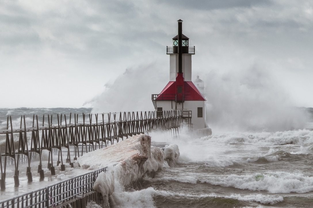 Waves wash over the pier at St. Joseph Harbor in Michigan, photo by Peter Brown.