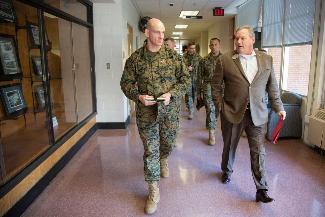 U.S. Marine Corps Sgt. Maj. Troy E. Black, left, the 19th sergeant major of the Marine Corps, is briefed by Bill Oldenburg, transition readiness manager, during a visit to Marine Corps Base Camp Lejeune, Jan. 8, 2020. Black visited for familiarization with the current posture of installation services, health and welfare of service members, government employees and families within privatized military housing. (U.S. Marine Corps photo by Cpl. Dominique Osthoff)