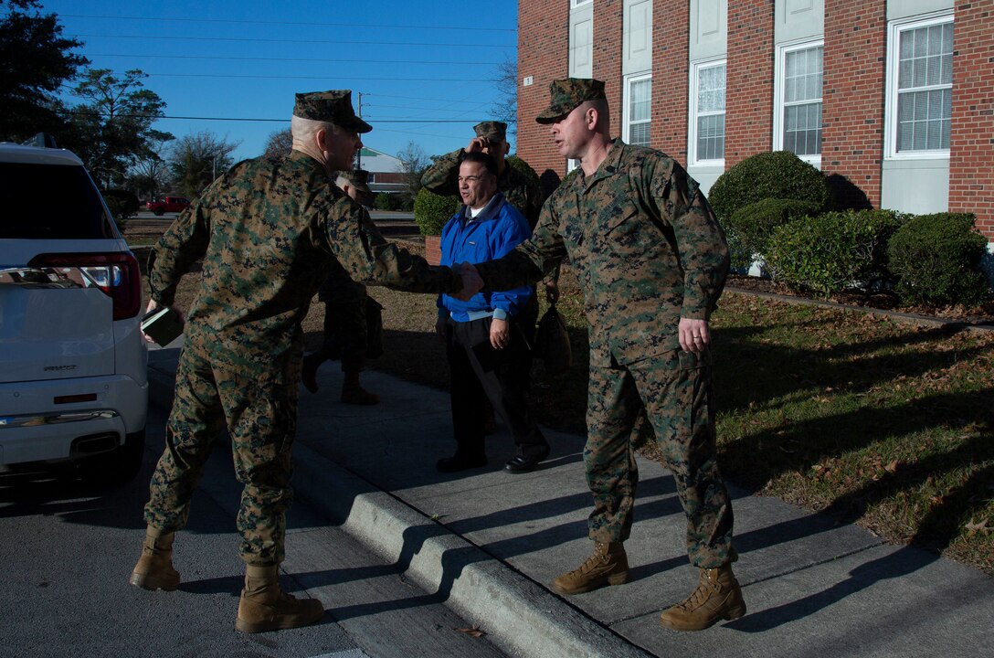 U.S. Marine Corps Sgt. Maj. Troy E. Black, left, the 19th sergeant major of the Marine Corps, greets Sgt. Maj. Bobby D. Frazier, right, sergeant major for Headquarters and Support Battalion, Marine Corps Installations East - Marine Corps Base Camp Lejeune, during a visit to MCB Camp Lejeune, North Carolina, Jan. 08, 2020. Black visited for familiarization with the current posture of Installation services, health and welfare of the service members, government employees and families within prIvatized military housing. (U.S. Marine Corps photo by Cpl. Dominique Osthoff)