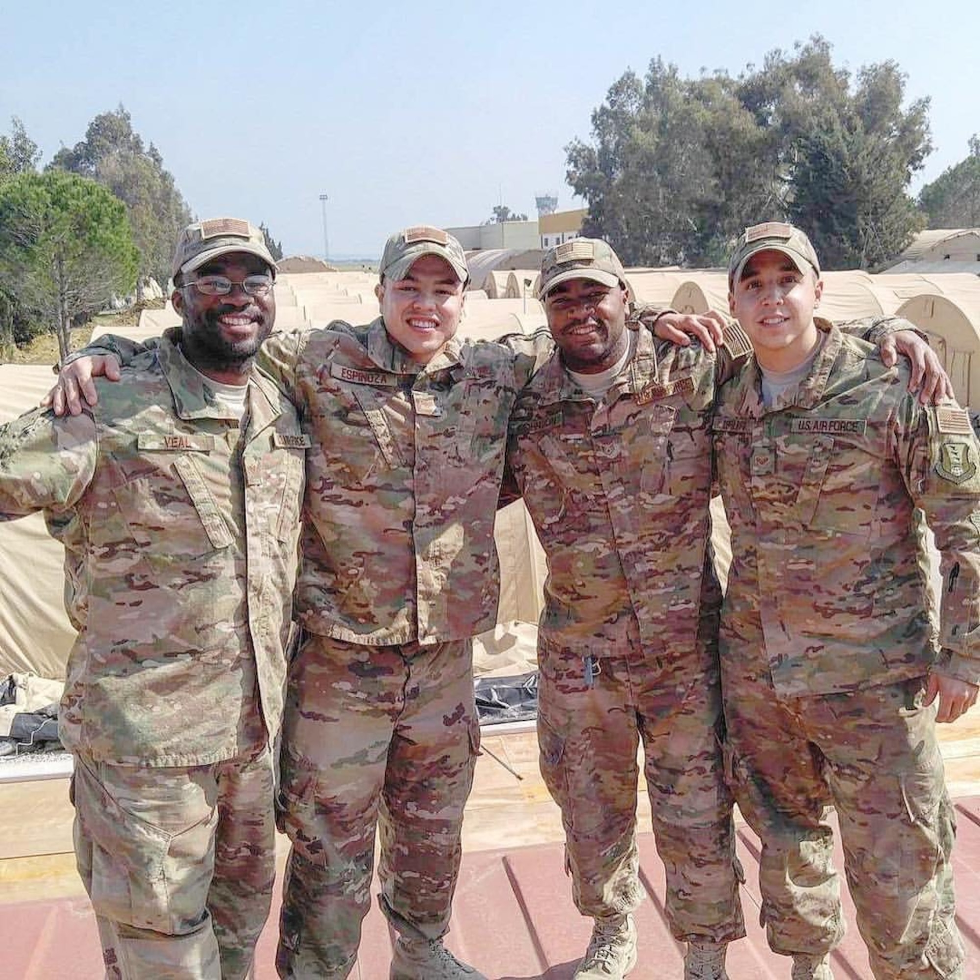 U.S. Air Force 20th Civil Engineer Squadron (CES) Airmen smile during a deployment at an undisclosed location, circa 2017.