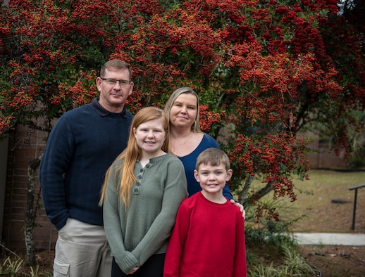 U.S. Air Force Tech Sgt. David Hines, 20th Civil Engineer Squadron planning manager, left, stands with his family at Shaw Air Force Base, South Carolina, Dec. 20, 2019.