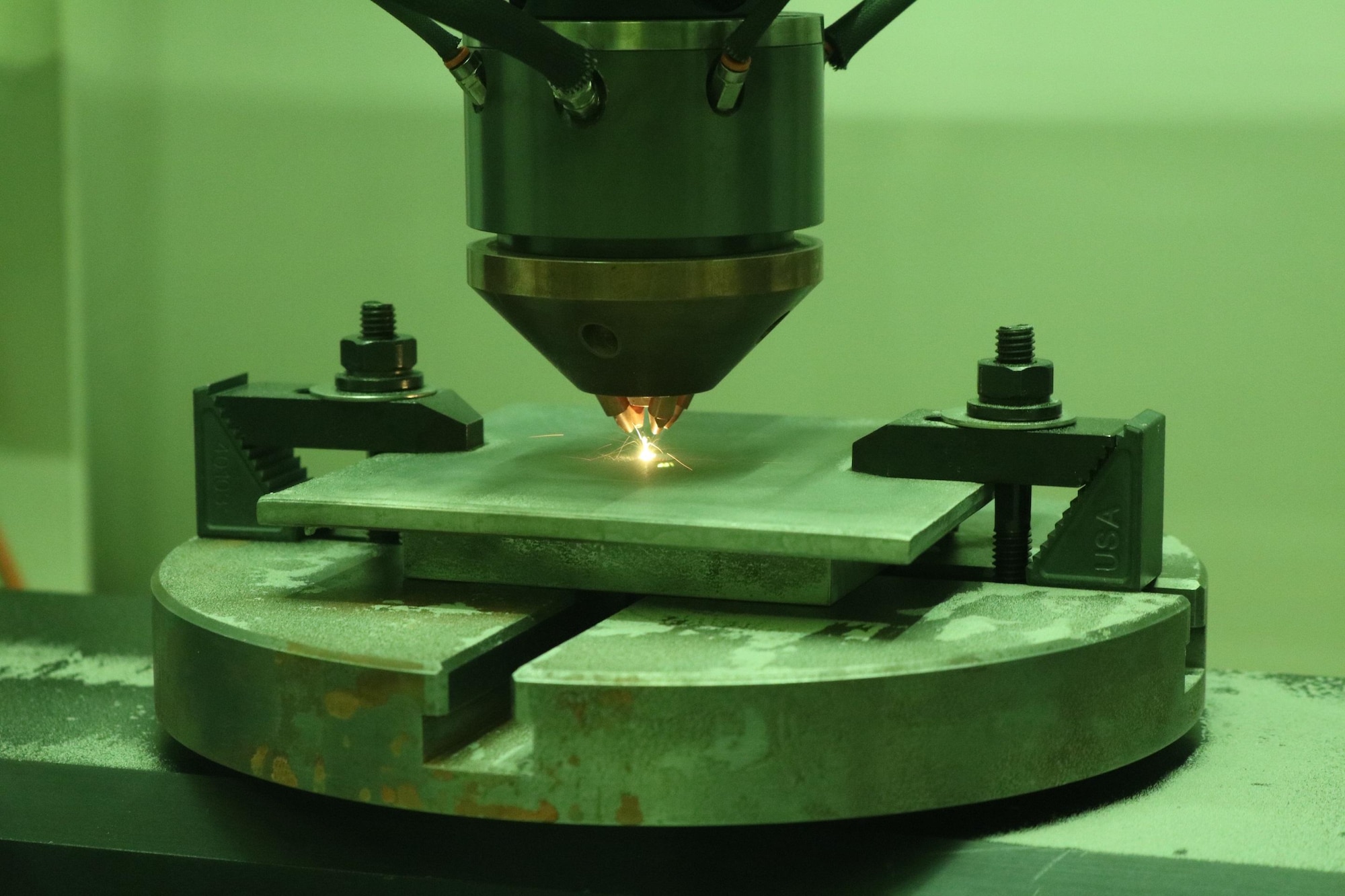 Optomec CS-800 DED system conducts bead on a plate trials.