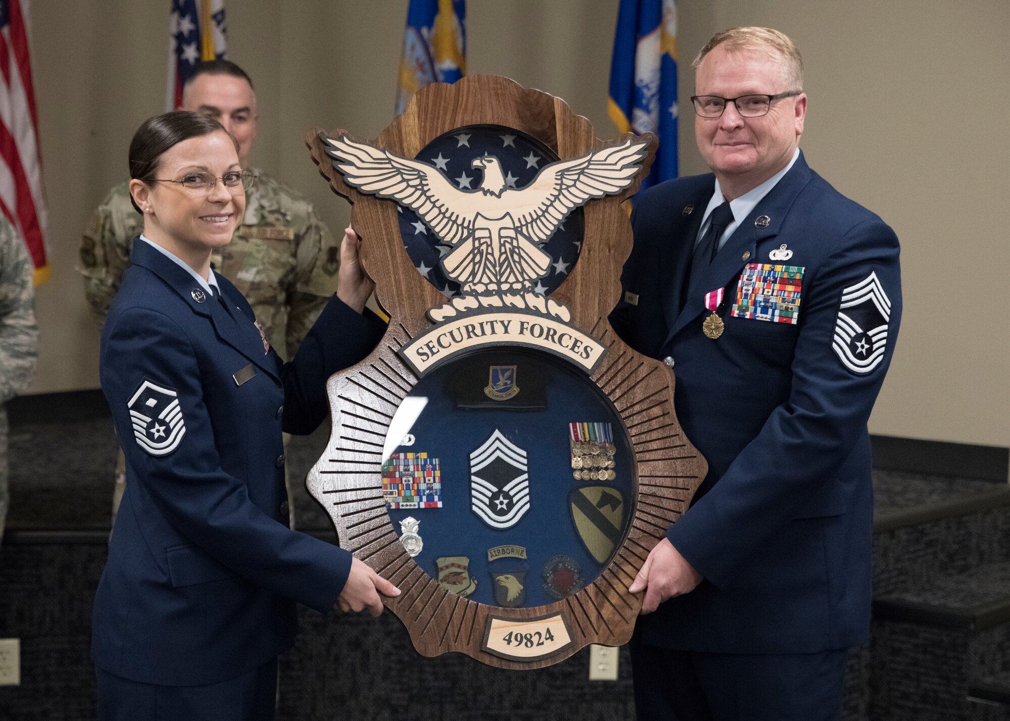 Chief Master Sgt. Edgar S. Mahan, 188th Mission Support Group chief, is presented with a shadowbox during his retirement ceremony at Ebbing Air National Guard Base, Ark., Jan. 11, 2020. Mahan served 30 years in the United States armed forces including the Marines, Army National Guard, and Air National Guard. (U.S. Air National Guard photo by Tech. Sgt. Daniel Condit)