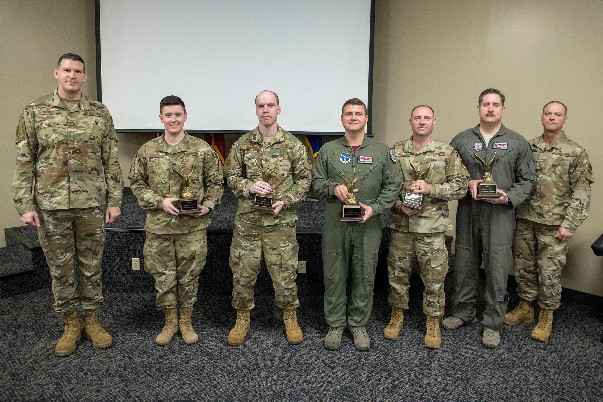 The 188th Wing’s Outstanding Airmen of the Year pose for a photo with wing leadership during a recognition ceremony at Ebbing Air National Guard Base, Ark., Jan 11, 2020. From left, Col. Leon Dodroe, 188th Wing commander, Senior Airman Hannah Martin, Outstanding Junior Enlisted Airman of the Year, Tech. Sgt. Justin Brown, Outstanding NCO of the Year; Senior Master Sgt. Michael Wilmouth, Outstanding Senior NCO of the Year; Master Sgt. Timothy Curd, Outstanding First Sergeant of the Year; Lt. Col. Douglas Olson, 188th Operations Group Director of Operations, accepting on behalf of Maj. Seth Simpson, Outstanding Field Grade Officer of the Year; Chief Master Sgt. Donnie Frederick, 188th Wing Command Chief Master Sergeant. Not pictured is Capt. Logan Huffman, Outstanding Company Grade Officer of the Year. (U.S. Air National Guard photo by Airman 1st Class Christopher Sherlock)