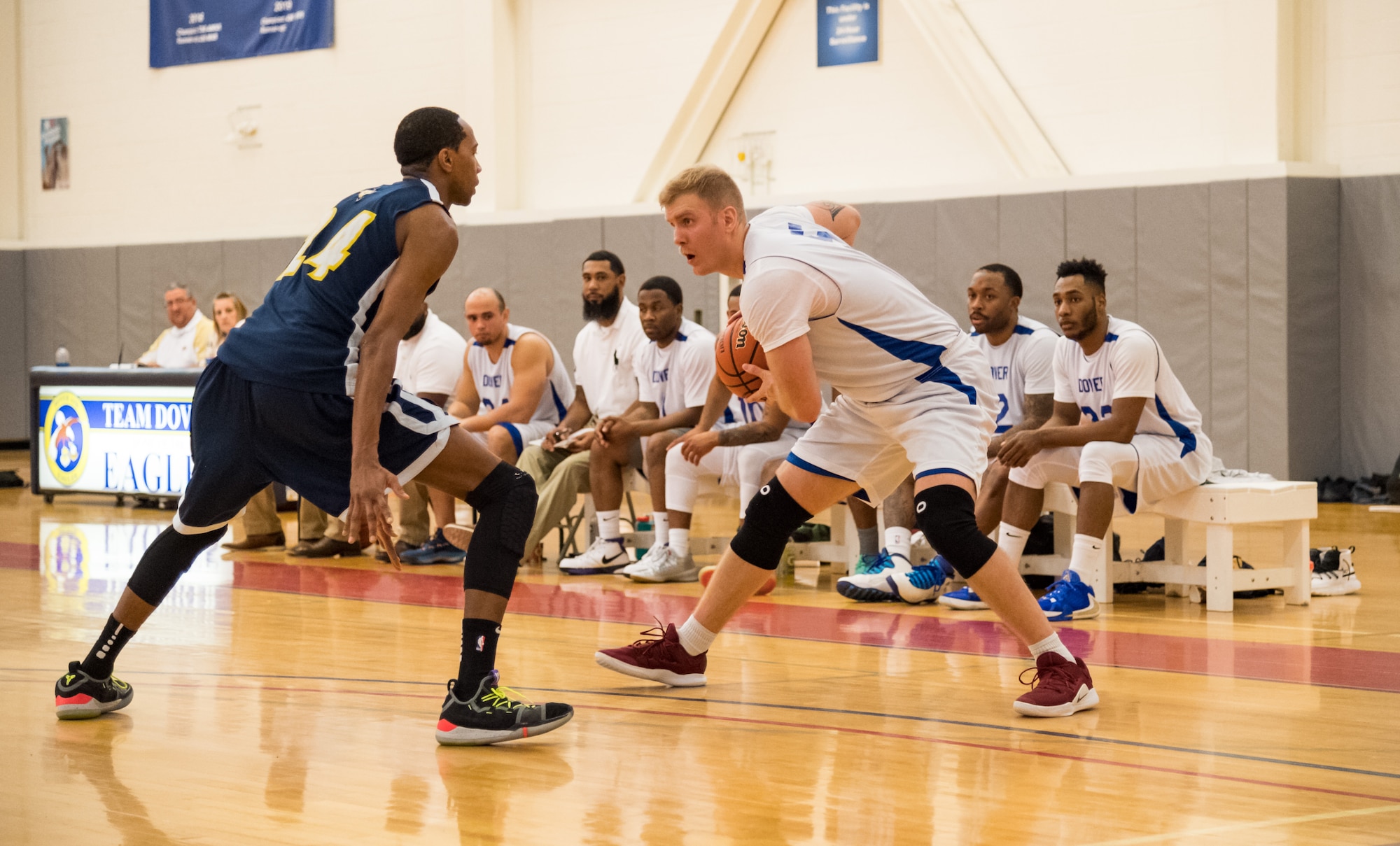 Dover Air Force Base Eagles center Ian McVay looks for a way to get around Naval Support Activity Bethesda Warriors forward Jamaal Thomas Jan. 12, 2020, at the Fitness Center on Dover Air Force Base, Del. The Warriors topped the Eagles, 88-70, in the Washington Area Military Athletic Conference game. (U.S. Air Force photo by Roland Balik)