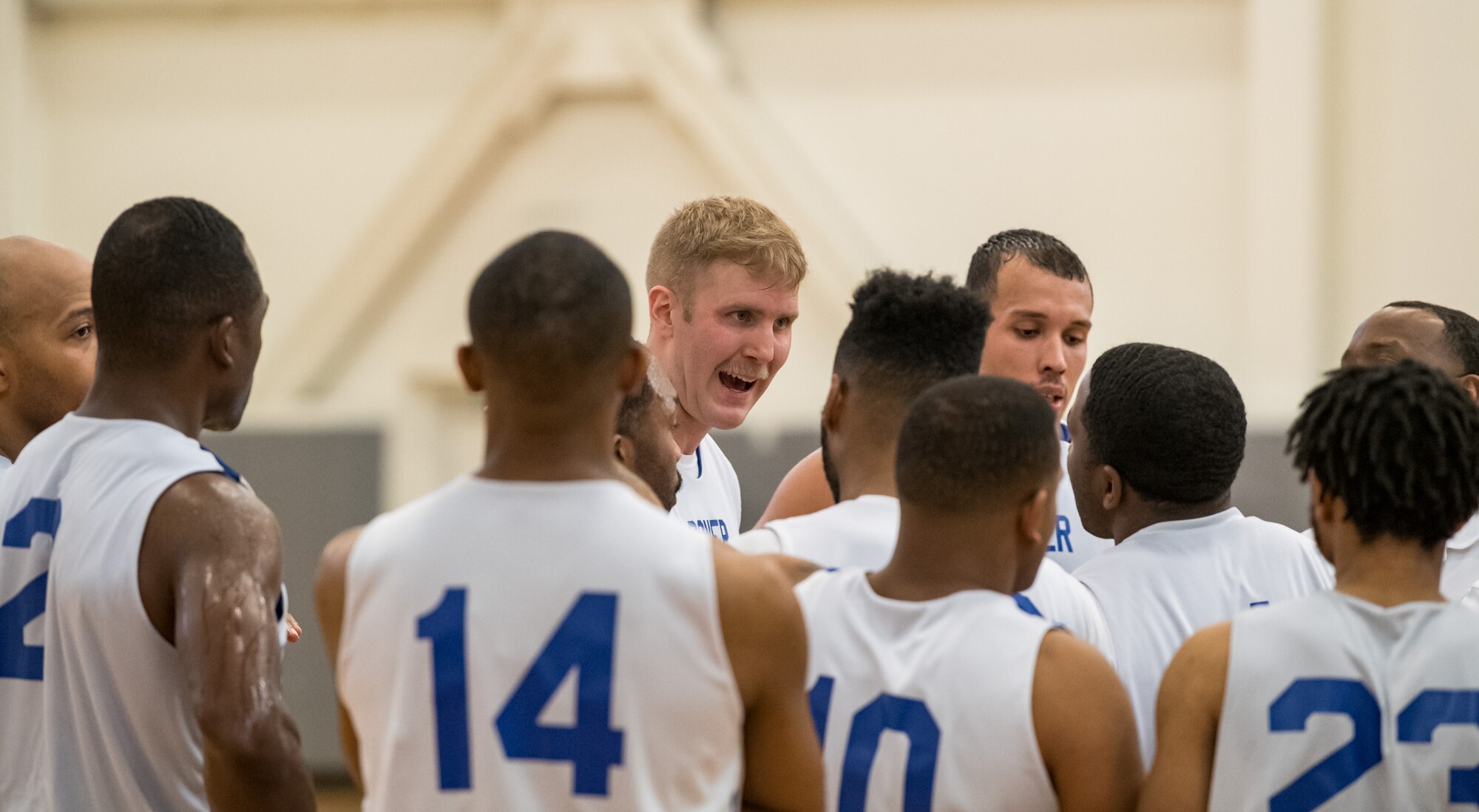 In his last game with the Dover Air Force Base Eagles, center Ian McVay motivates fellow Eagles during the final minutes of the basketball game against the Naval Support Activity Bethesda Warriors Jan. 12, 2020, at the Fitness Center on Dover Air Force Base, Del. McVay ended up with 19 points, however the Warriors topped the Eagles, 88-70. (U.S. Air Force photo by Roland Balik)