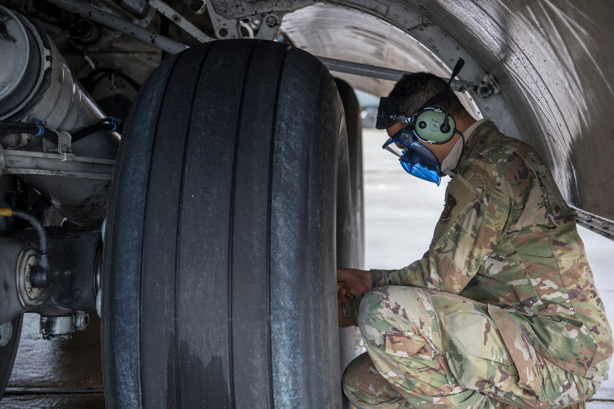 U.S. Air Force Staff Sgt. Matthew F. Varela, 514th Aircraft Maintenance Squadron crew chief with the 514th Air Mobility Wing, Joint Base McGuire-Dix-Lakehurst, N.J., checks the tire pressure on a C-17 Globemaster III after it arrives at Holloman Air Force Base, N.M., Jan. 10, 2020. Airmen from the 514th AMXS joined members from the 732nd Airlift Squadron, as they flew a sortie to Naval Air Station Key West, Fla. (U.S. Air Force photo by Senior Airman Ruben Rios)