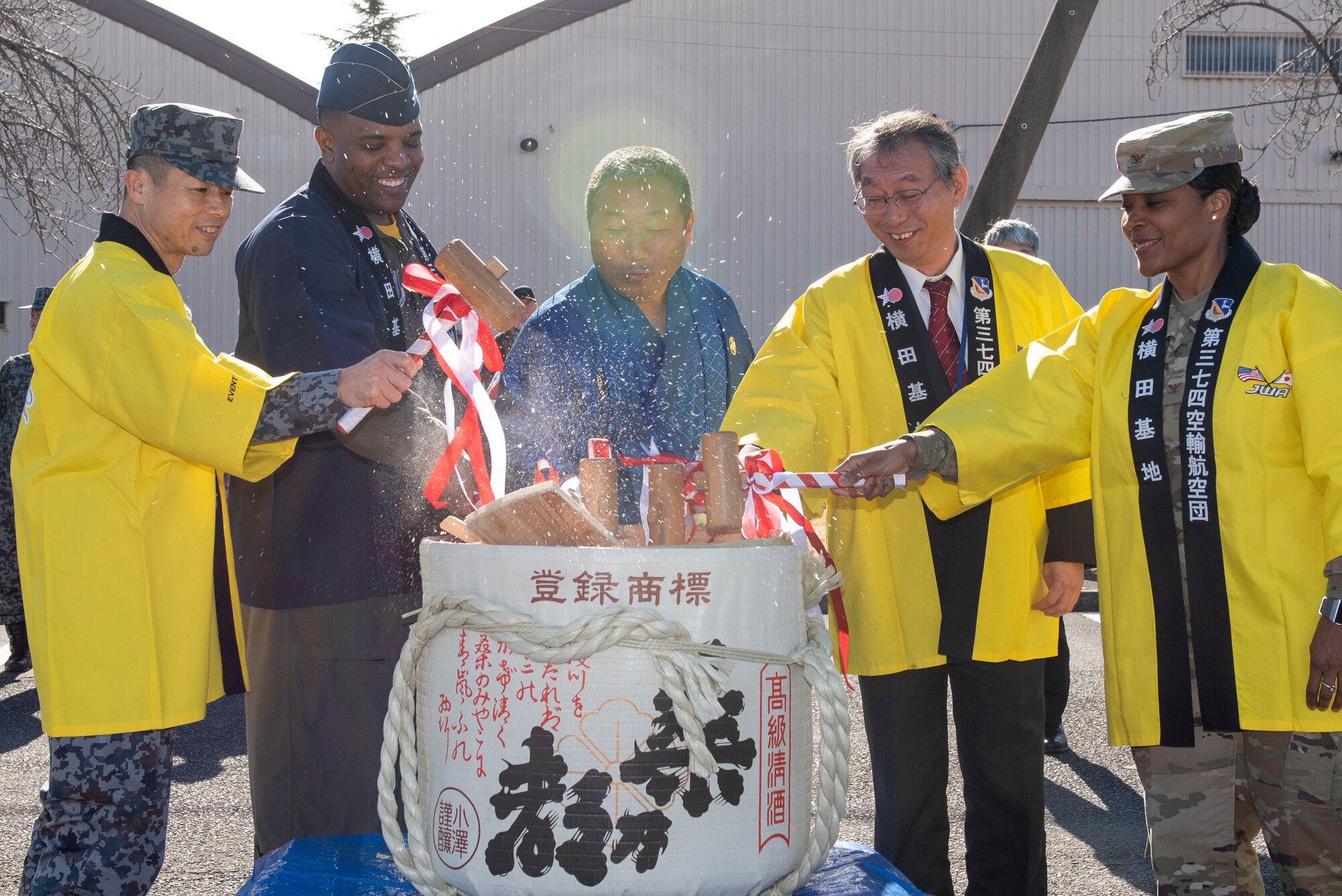 Yokota leadership breaks open a sake barrel along with the Japanese Welfare Association, Japan Air Self-Defense Force and Yokota Defense Office’s leaders during the JWA New Year Fest, Jan.10, 2020, at Yokota Air Base, Japan.