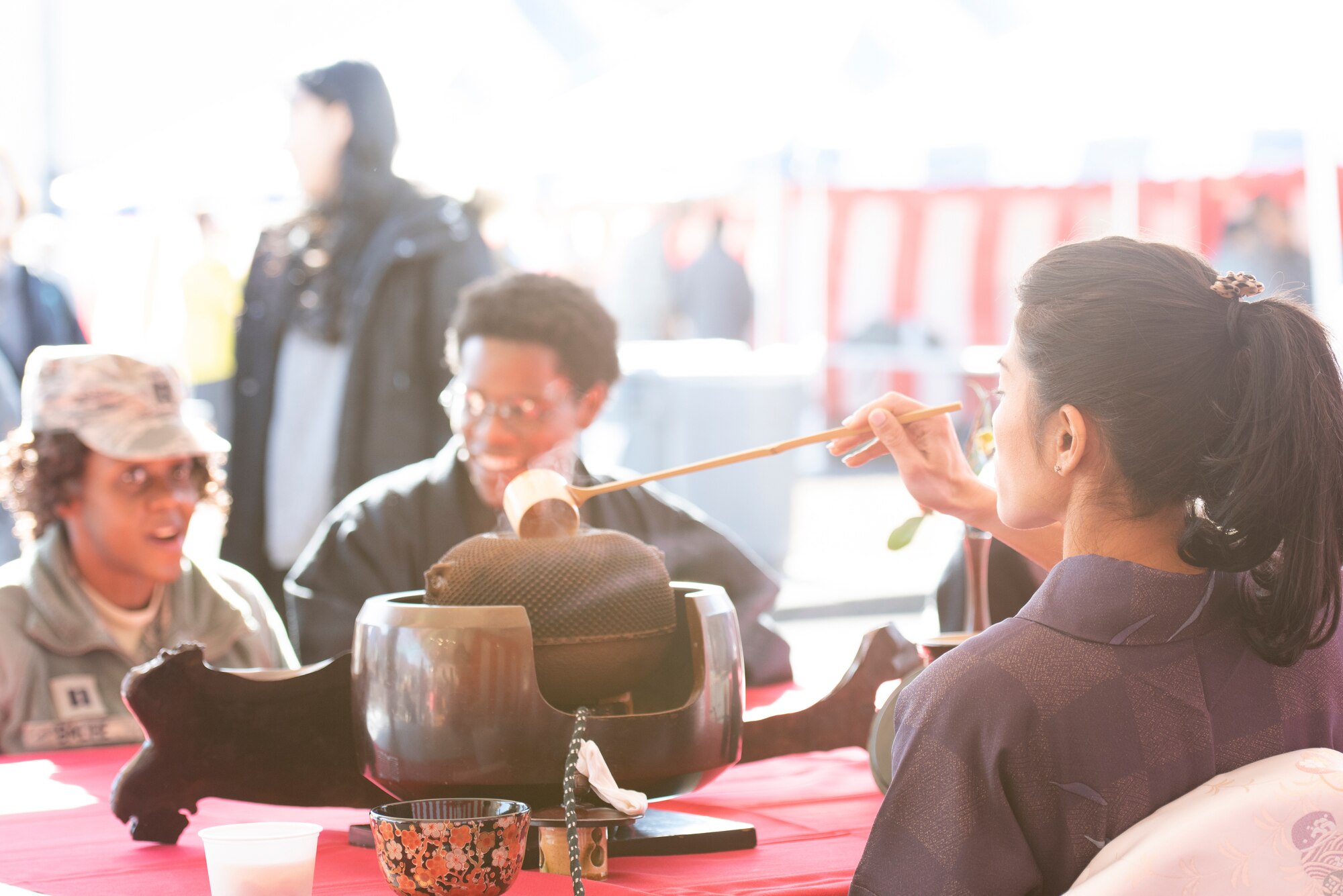 A Japanese employee prepares Matcha green tea for festival attendees during the New Year Fest hosted by the Japanese Welfare Association, Jan.10, 2020, at Yokota Air Base, Japan.