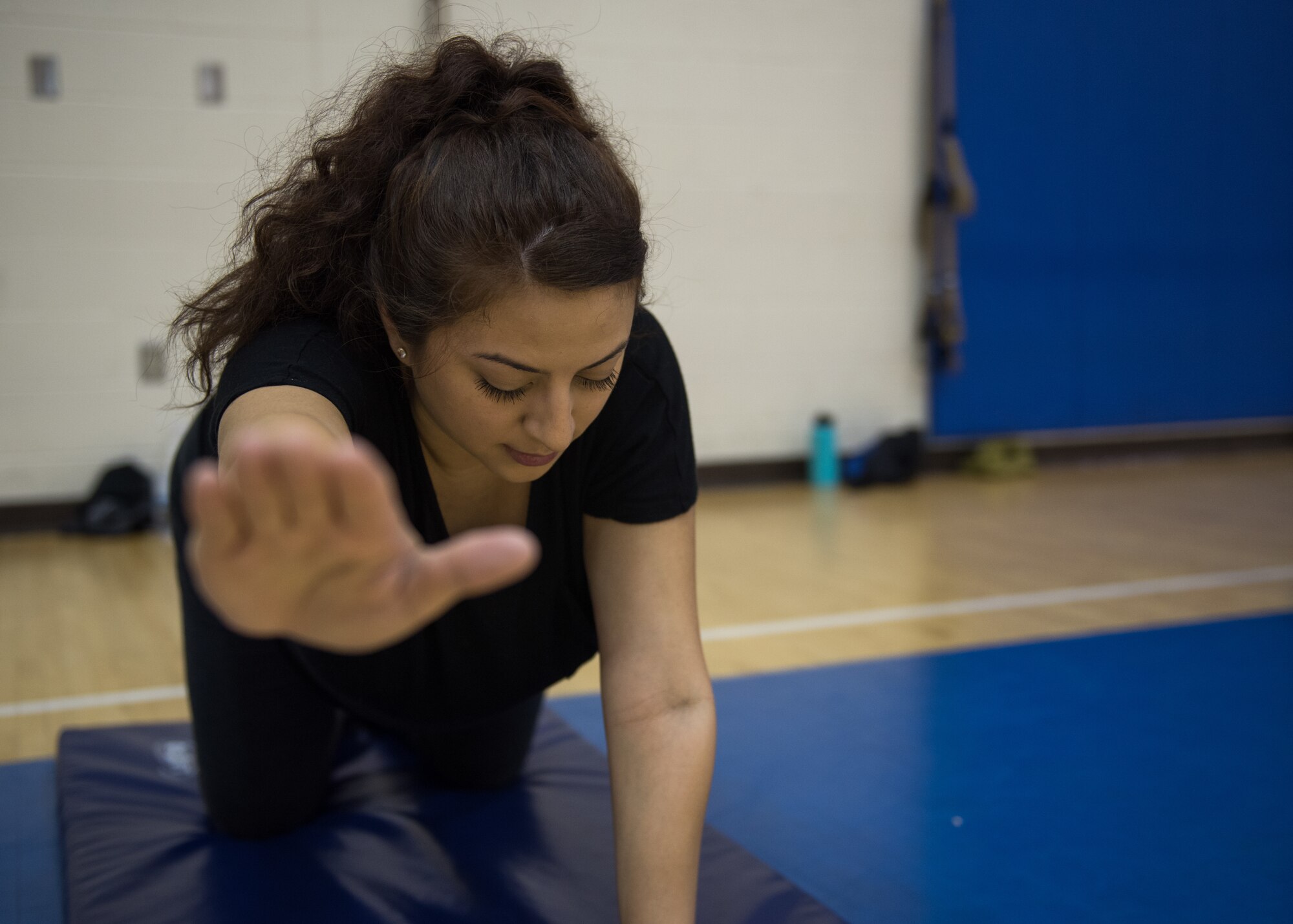 U.S. Air Force Senior Airman Alexandra Singer performs a bird dog exercise at Joint Base Langley-Eustis, Virginia, Jan. 13, 2020.