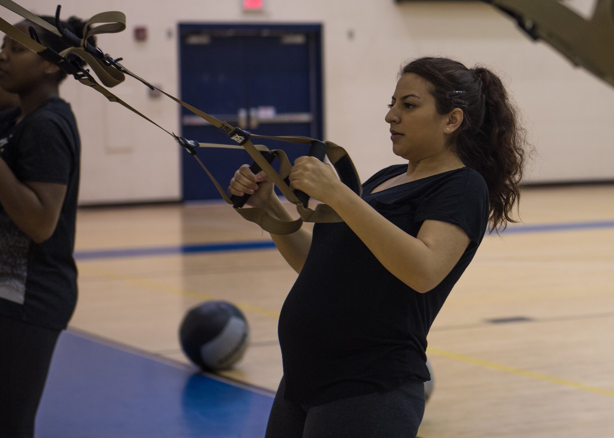 U.S. Air Force Senior Airman Alexandra Singer performs a TRX row exercise at Joint Base Langley-Eustis, Virginia, Jan. 13, 2020.