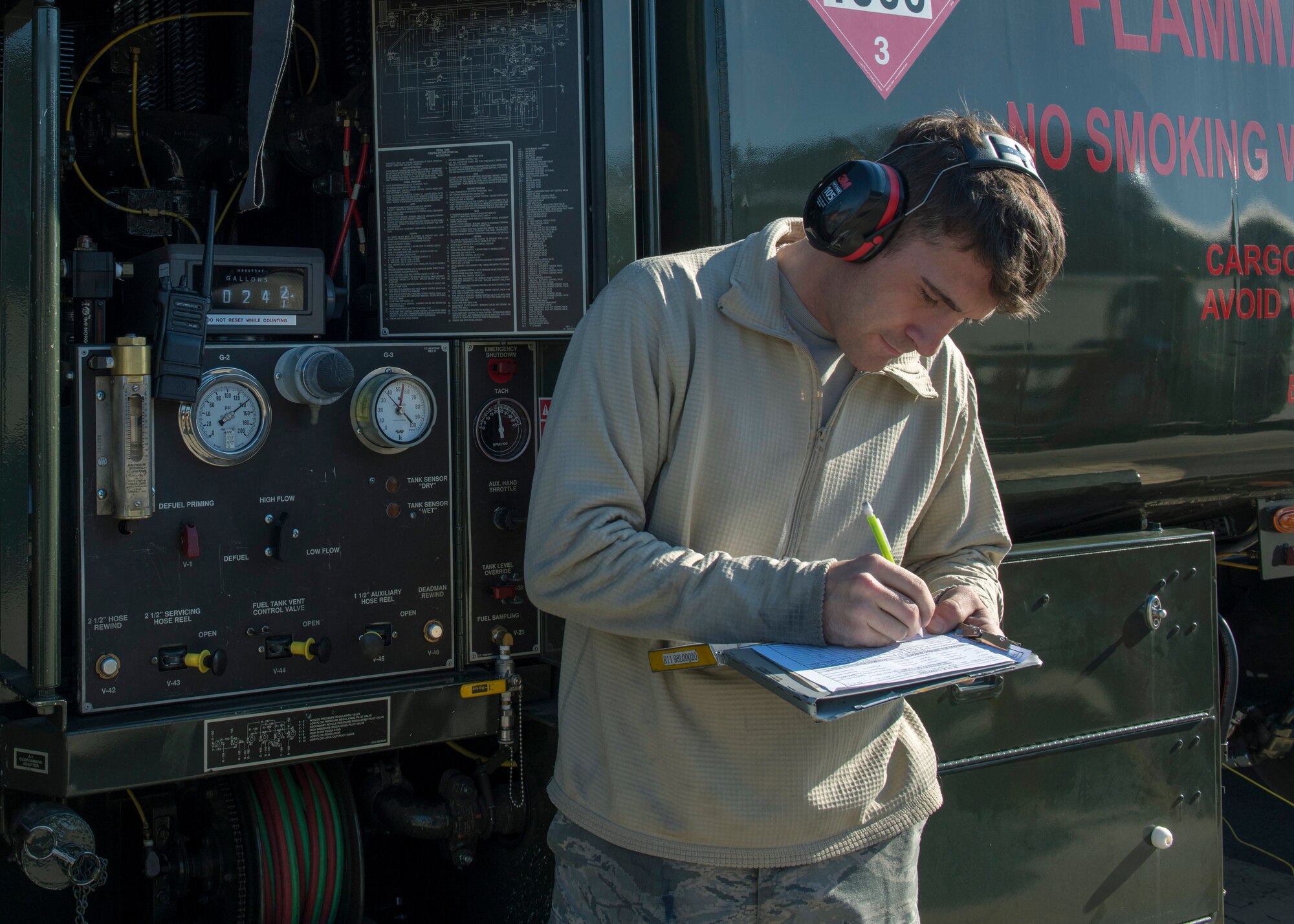 Airman 1st Class Zachary Leboeuf, 4th Logistics Readiness Squadron fuel distribution operator, documents the F-15E Strike Eagles tail number and the amount of jet fuel distributed during hot-pit refueling.