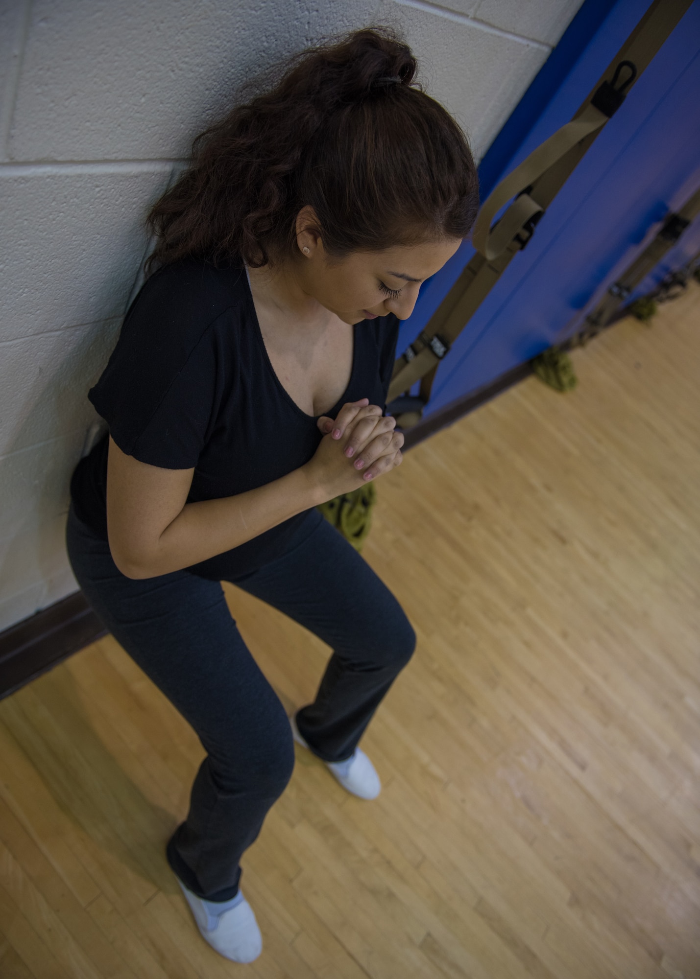 U.S. Air Force Senior Airman Alexandra Singer performs a wall sit at Joint Base Langley-Eustis, Virginia, Jan. 13, 2020.