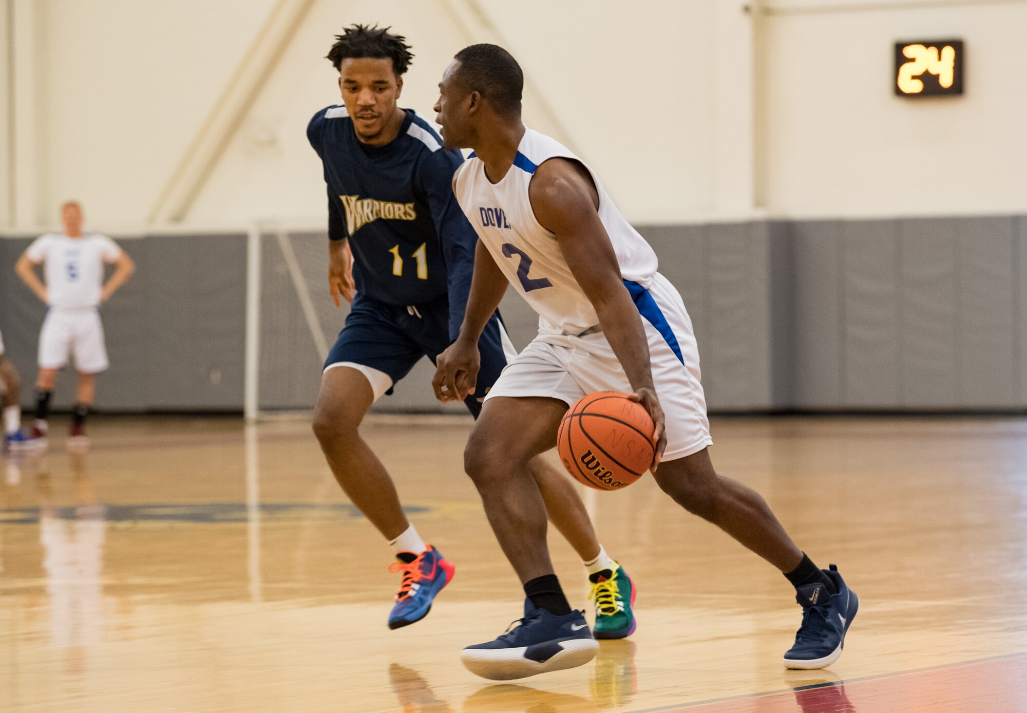 Dover Air Force Base Eagles guard Maurice Hargraves (2) dribbles around Naval Support Activity Bethesda Warriors guard William Gilmore Jan. 12, 2020, at the Fitness Center on Dover AFB, Del. The Warriors topped the Eagles, 88-70, in a Washington Area Military Athletic Conference basketball game. (U.S. Air Force photo by Roland Balik)