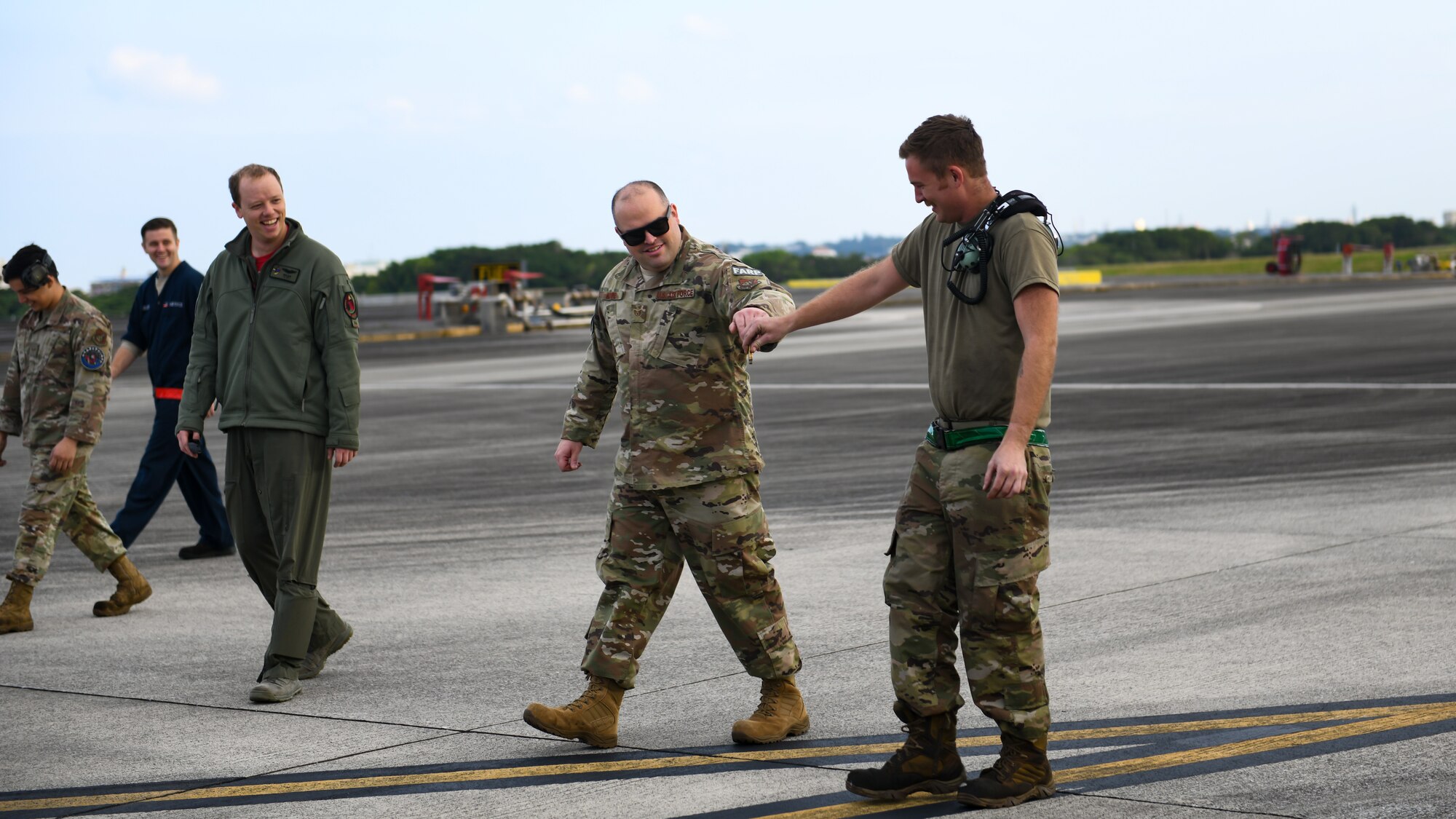 Maintainers from the 18th Aircraft Maintenance Squadron, 67th Aircraft Maintenance Unit, conduct a walk for foreign object debris during Exercise Rumrunner at Marine Corps Air Station Futenma, Japan, Jan. 10, 2020. The 18th Wing and its joint partners executed the first WestPac Rumrunner exercise, which focused on defensive counter air capabilities and joint interoperability using agile combat employment concepts. (U.S. Air Force photo by Staff Sgt. Benjamin Raughton)