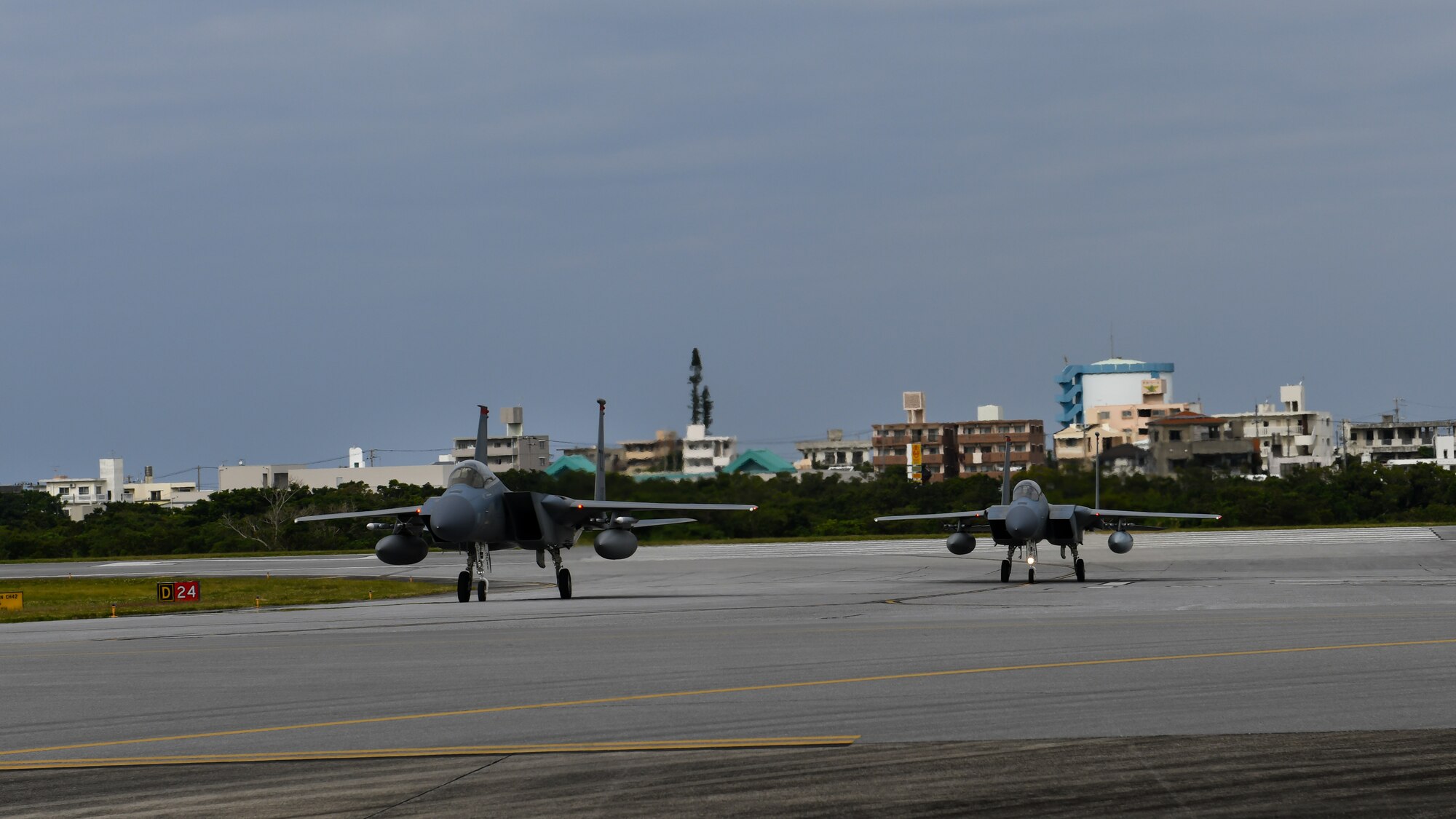 Two F-15C Eagles land during Exercise Rumrunner at Marine Corps Air Station Futenma, Japan, Jan. 10, 2020. The 18th Wing and its joint partners executed the first WestPac Rumrunner exercise, which focused on defensive counter air capabilities and joint interopability using agile combat employment concepts. (U.S. Air Force photo by Staff Sgt. Benjamin Raughton)