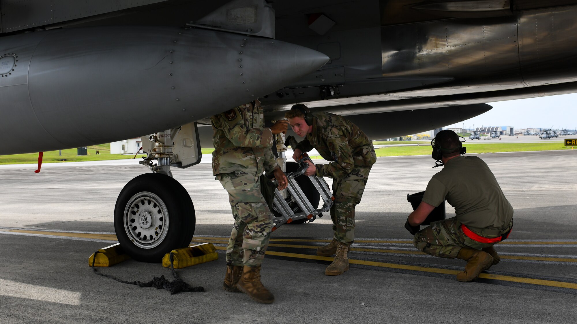 Maintainers from the 18th Aircraft Maintenance Squadron, 67th Aircraft Maintenance Unit, practice de-arming an F-15C Eagle during Exercise Rumrunner at Marine Corps Air Station Futenma, Japan, Jan. 10, 2020. The 18th Wing and its joint partners executed the first WestPac Rumrunner exercise, which focused on defensive counter air capabilities and joint interoperability using agile combat employment concepts. (U.S. Air Force photo by Staff Sgt. Benjamin Raughton)