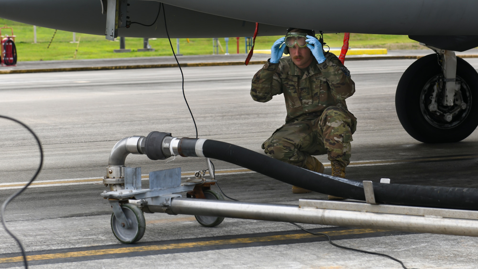 A maintainer from the 18th Aircraft Maintenance Squadron prepares to fuel an F-15C Eagle during Exercise Rumrunner at Marine Corps Air Station Futenma, Japan, Jan. 10, 2020. The 18th Wing and its joint partners executed the first WestPac Rumrunner exercise, which focused on defensive counter air capabilities and joint interoperability using agile combat employment concepts. (U.S. Air Force photo by Staff Sgt. Benjamin Raughton)