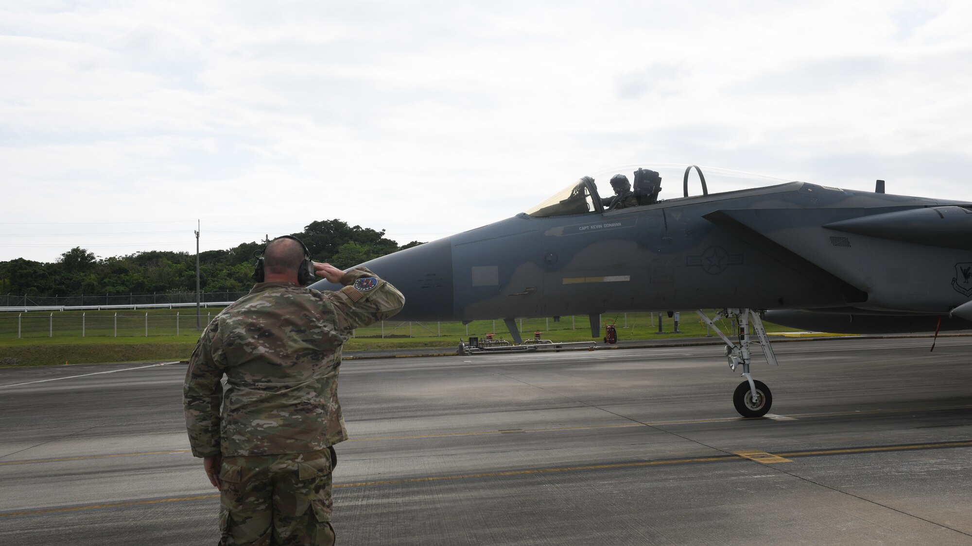 U.S. Air Force Staff. Sgt. Adam Kope, 18th Aircraft Maintenance Squadron, 67th Aircraft Maintenance Unit F-15C Eagle dedicated crew chief, marshals an F-15 Eagle during Exercise Westpac Rumrunner at Marine Corps Air Station Futenma, Jan. 10, 2020. The 18th Wing and its joint partners executed the first WestPac Rumrunner exercise, which focused on defensive counter air capabilities and joint interoperability using agile combat employment concepts. (U.S. Air Force photo by Staff Sgt. Benjamin Raughton)