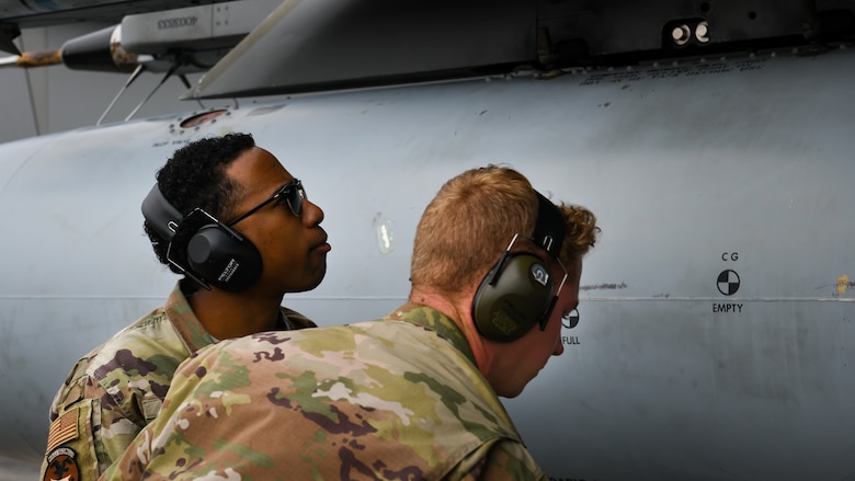 Maintainers from the 18th Aircraft Maintenance Squadron inspect an F-15C Eagle during Exercise WestPac Rumrunner at Marine Corps Air Station Futenma, Japan, Jan. 10, 2020. The 18th Wing and its joint partners executed the first WestPac Rumrunner exercise, which focused on defensive counter air capabilities and joint interoperability using agile combat employment concepts. (U.S. Air Force photos by Staff Sgt. Benjamin Raughton)