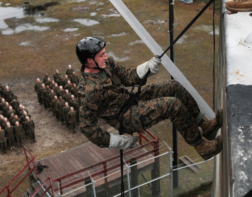 Recruits with Bravo Company, 1st Recruit Training Battalion, go down the rappel tower at Marine Corps Recruit Depot Parris Island, S.C., Dec. 30, 2019. The rappel tower is a training event designed to instill confidence and eliminate fear of heights within recruits. (U.S. Marine Corps photo by Lance Cpl. Godfrey Ampong)