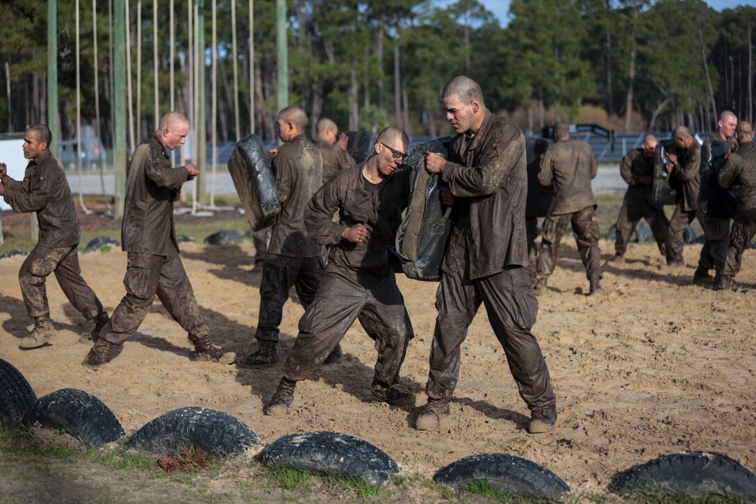 Recruits with Hotel Company, 2nd Recruit Training Battalion, participate in a Crucible event at Marine Corps Recruit Depot Parris Island, South Carolina, Jan. 10, 2020. The Crucible is a 54-hour field training exercise that presents continuous physical and mental challenges. (U.S. Marine Corps photo by Lance Cpl. Christopher McMurry)